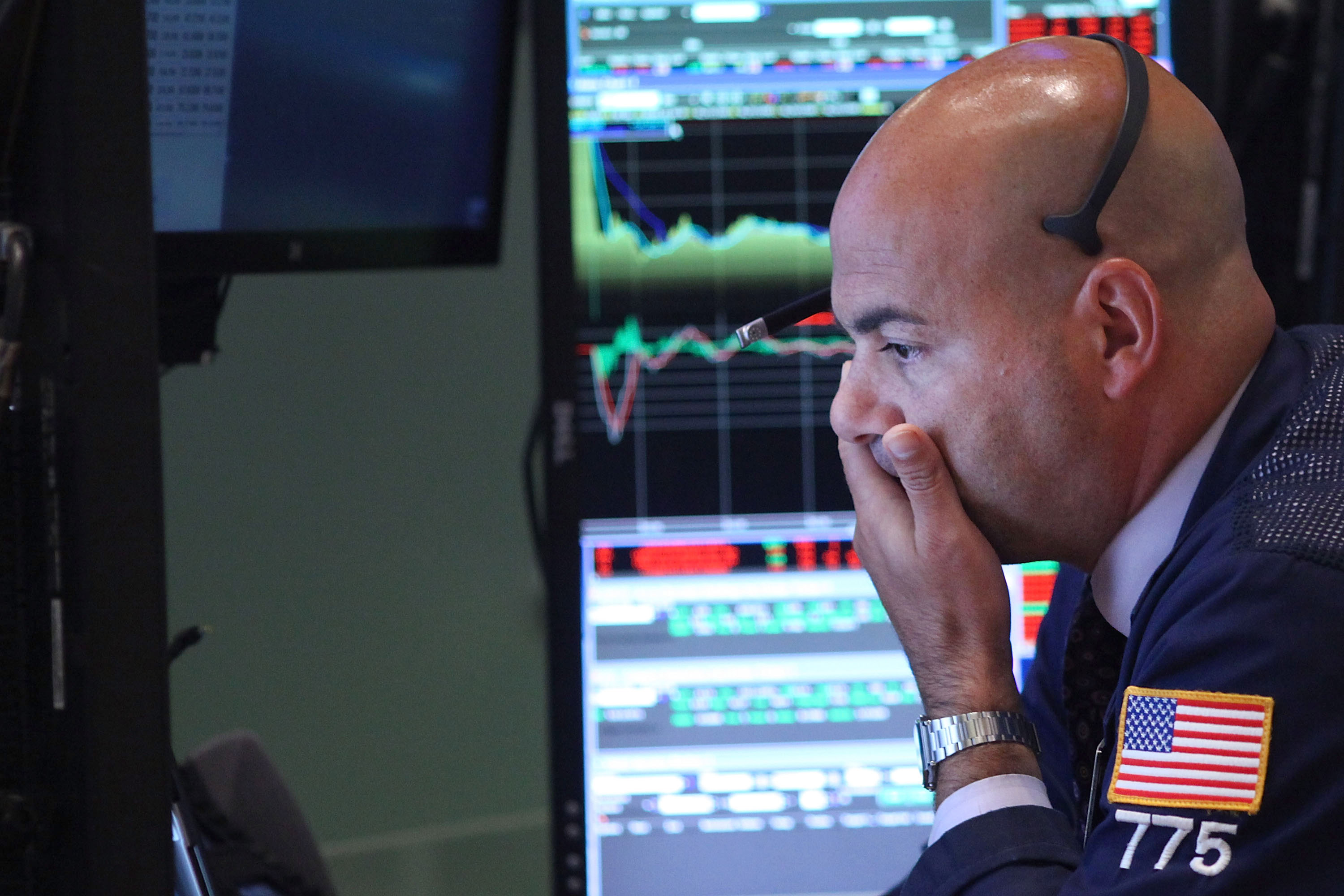 Traders react on the floor of the New York Stock Exchange on September 1, 2015 in New York City.