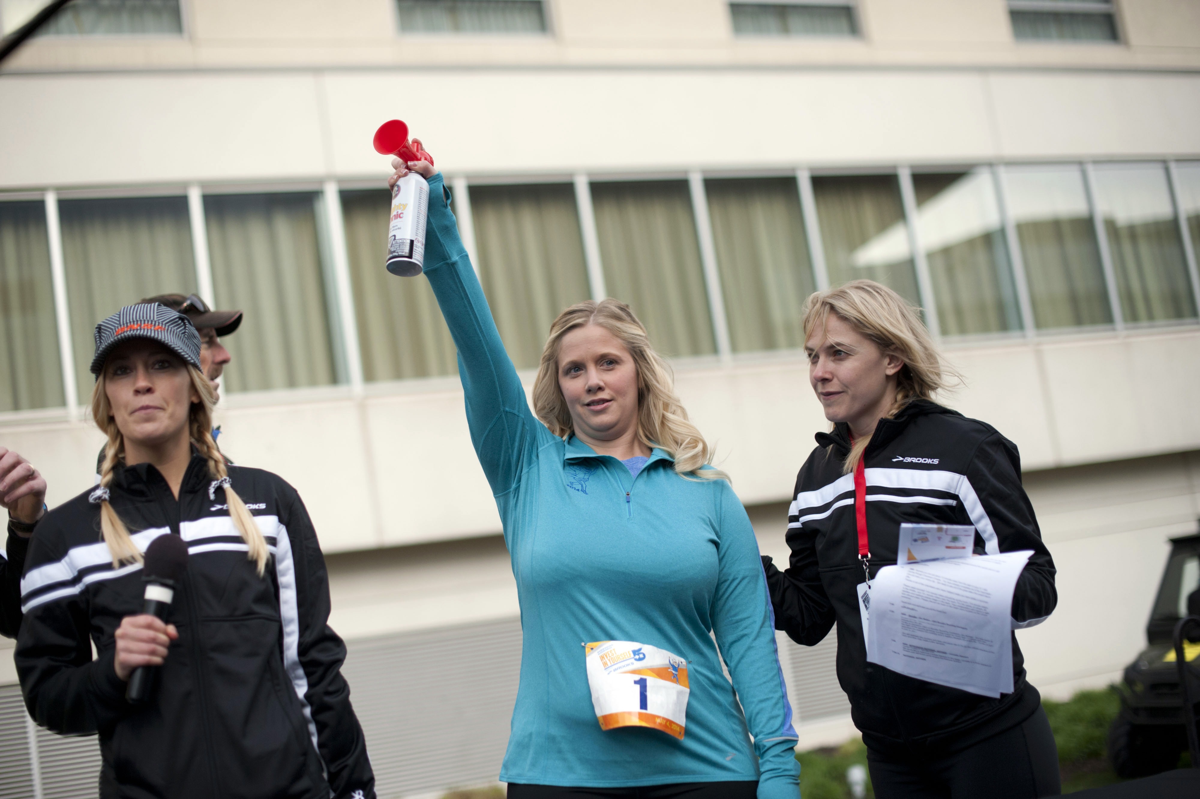 Warren Buffett protégé Tracy Britt Cool blasts an air-horn to start the 'Berkshire Hathaway Invest In Yourself 5K' race in May, 2014.