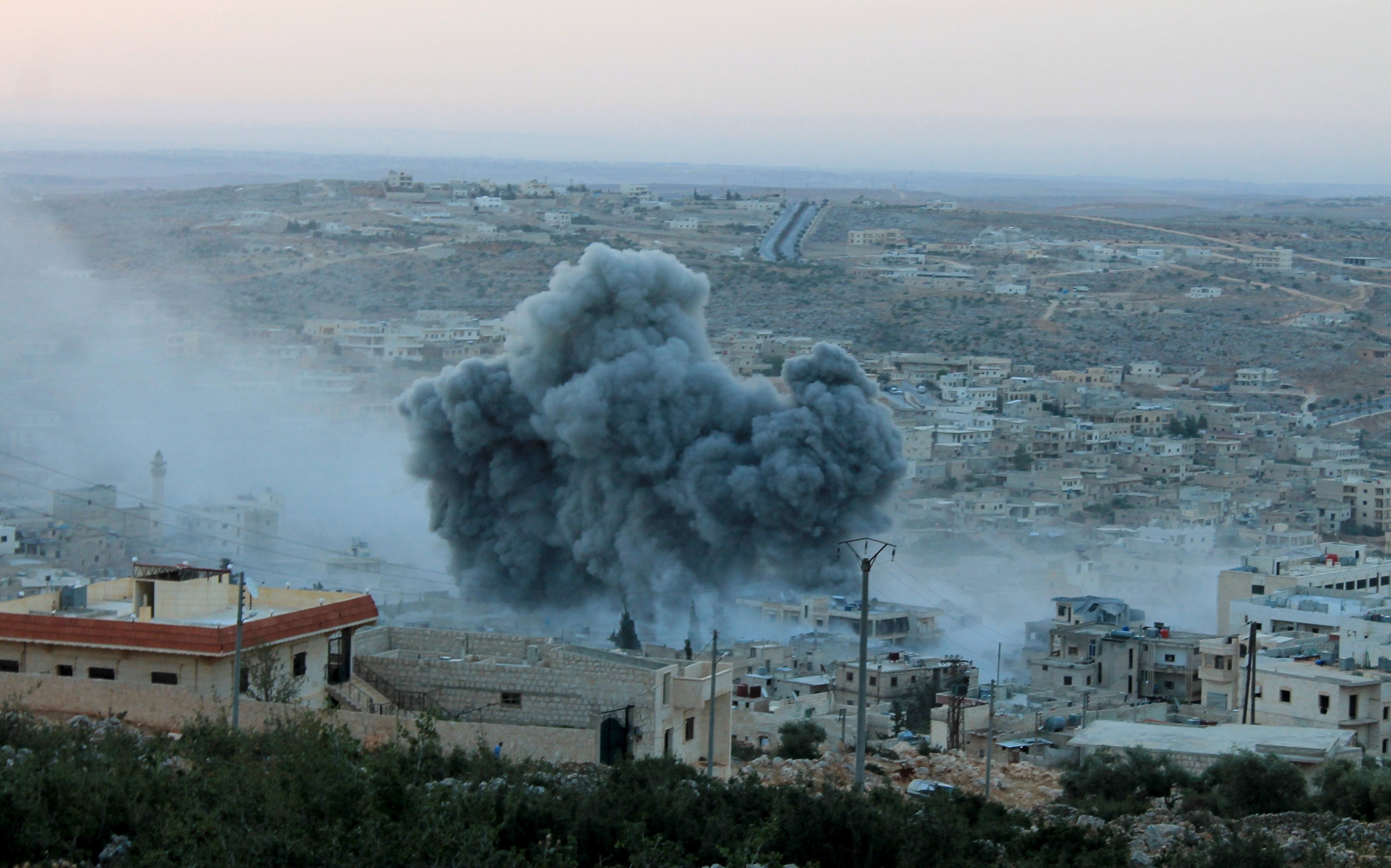 Smoke rises after Russian war crafts hit the Syrian opposition controlled town Daret Ezza in Aleppo, Syria Tuesday.