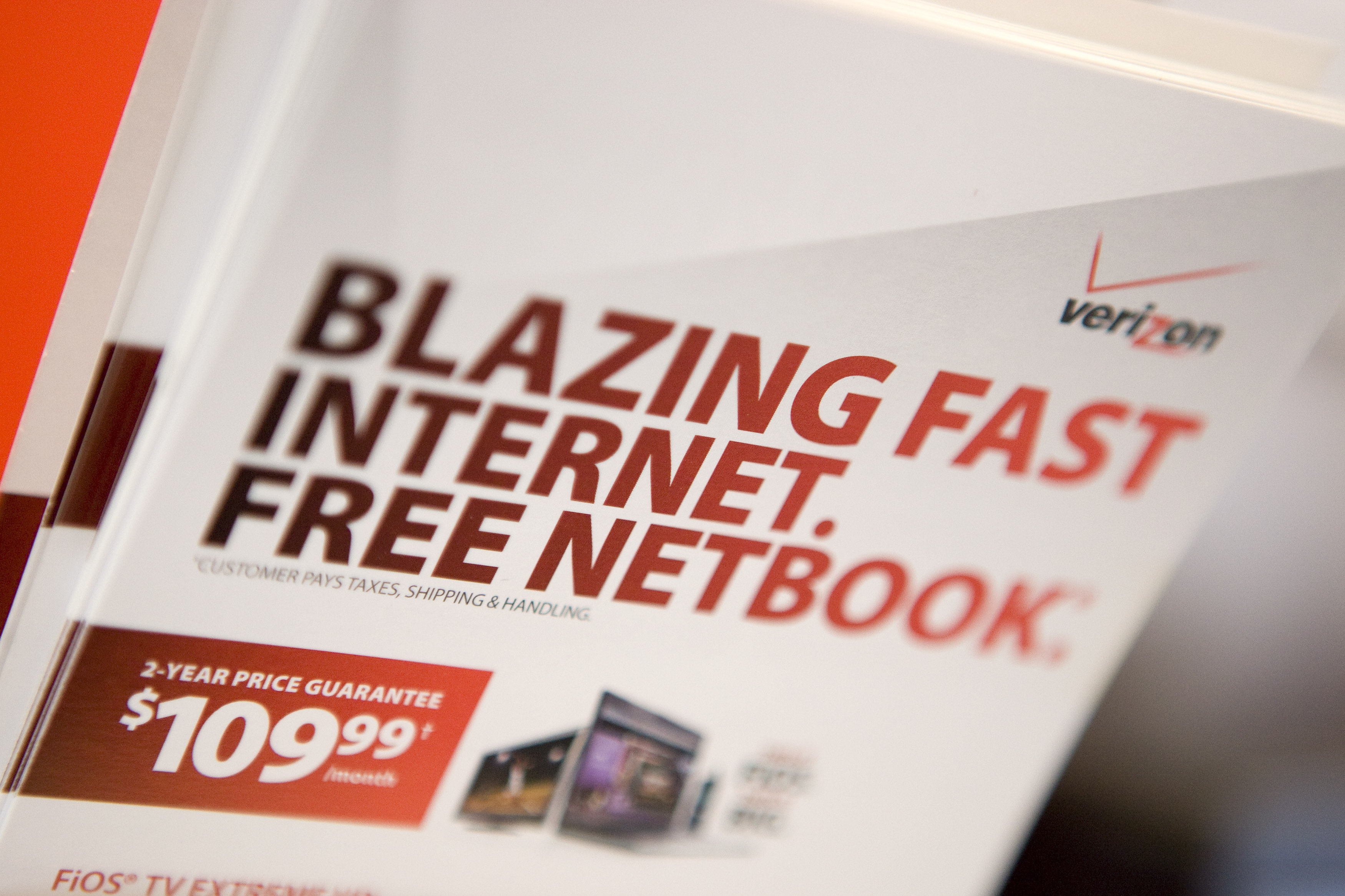 Brochures for Verizon FiOS and a free netbook sit inside a Verizon Wireless store in New York, U.S.