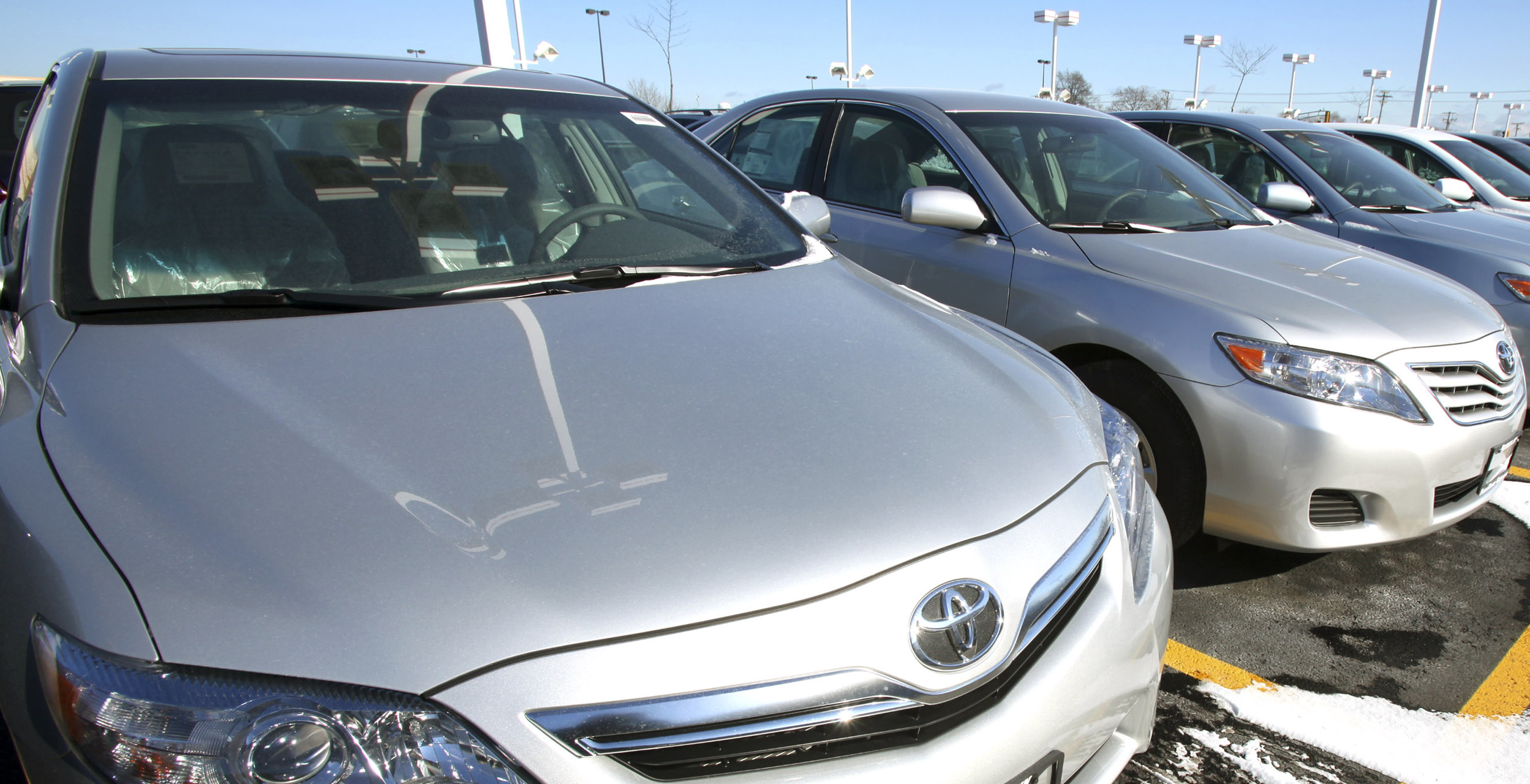 Toyota Camrys sit on the sales lot at Bredemann Toyota in Park Ridge, Illinois, U.S.