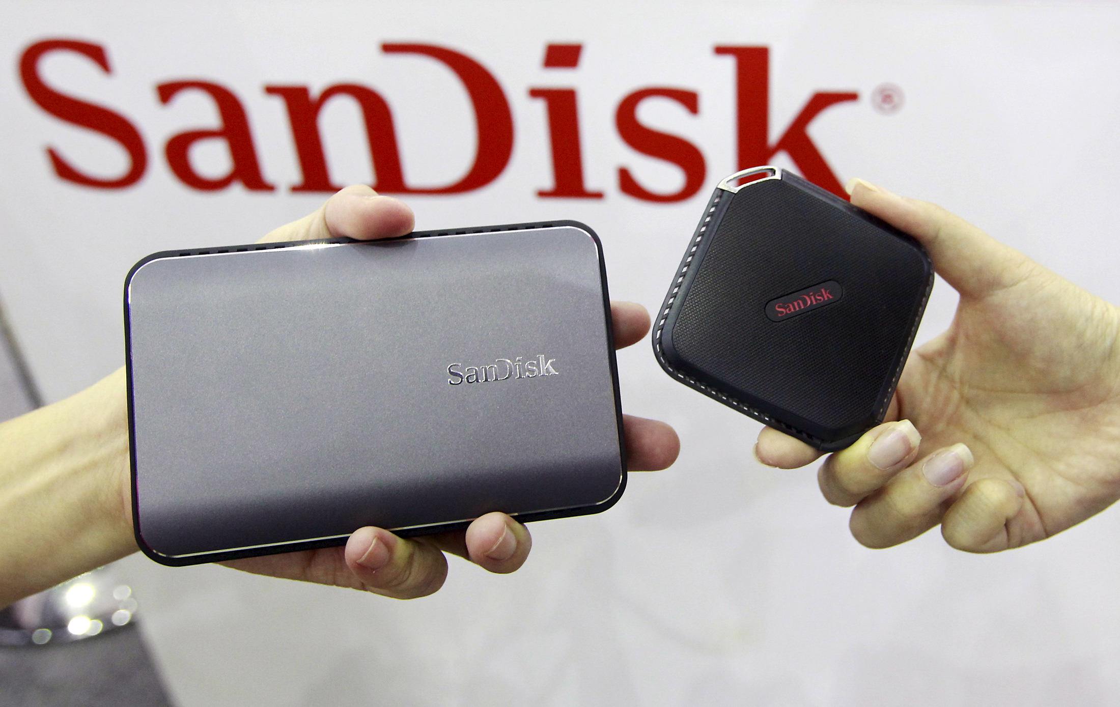 Sandisk's new portable solid state drives are displayed at the Sandisk booth during the 2015 Computex exhibition at the TWTC Nangang exhibition hall in Taipei, Taiwan