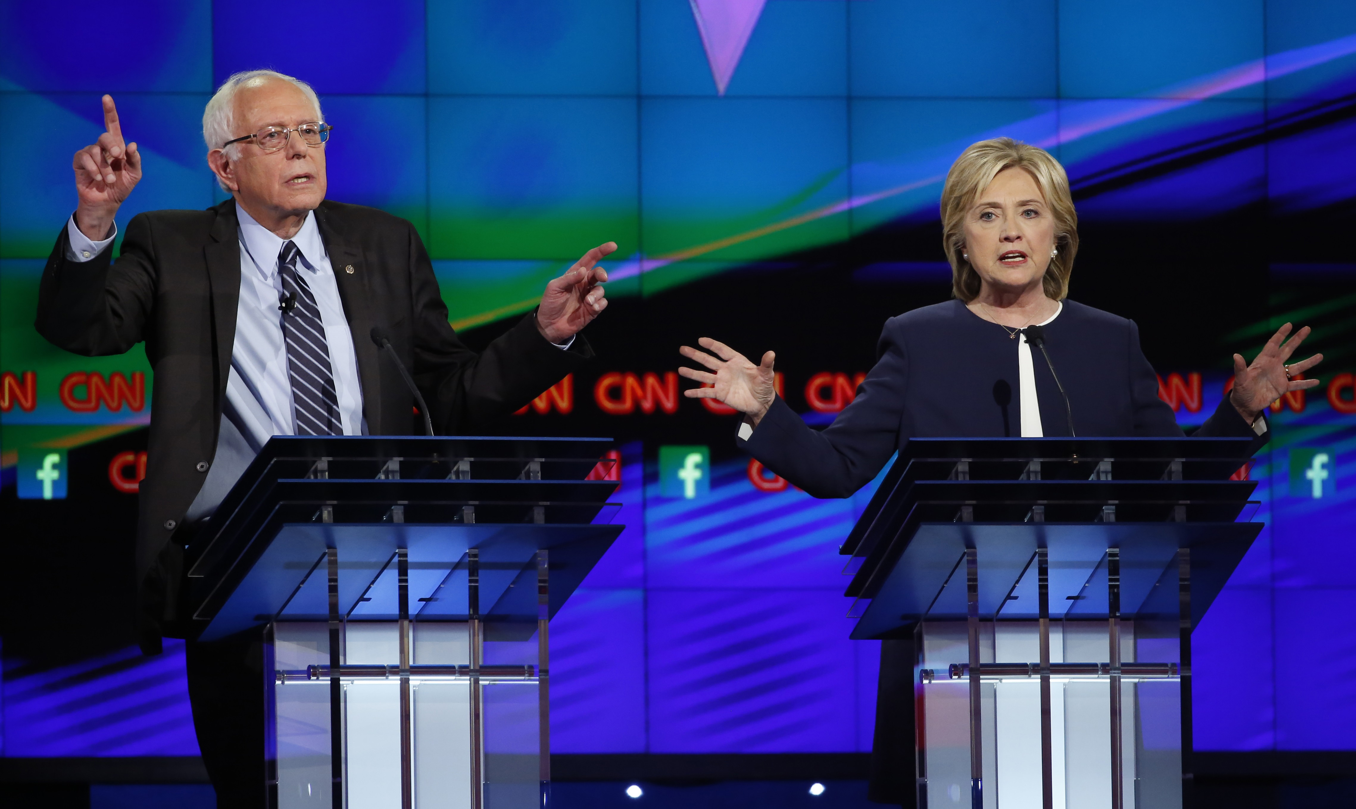 Democratic presidential candidates U.S. Senator Bernie Sanders and former Secretary of State Hillary Clinton debate during the first official Democratic candidates debate of the 2016 presidential campaign in Las Vegas