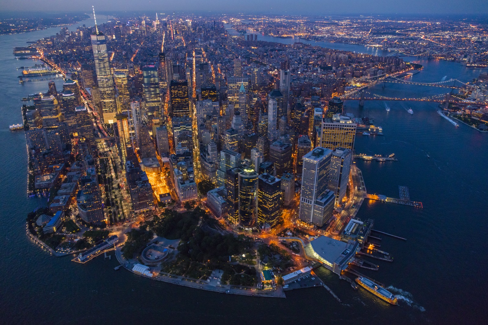 At twilight, Manhattan resembles a vast living organism with ribbons of energy pulsing through its streets and up into its hundred thousand buildings.