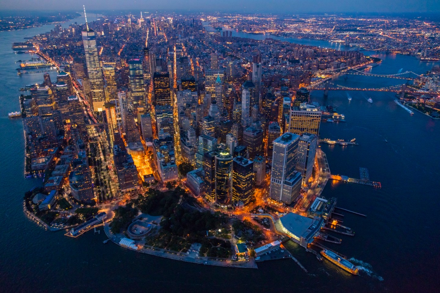 At twilight, Manhattan resembles a vast living organism with ribbons of energy pulsing through its streets and up into its hundred thousand buildings.