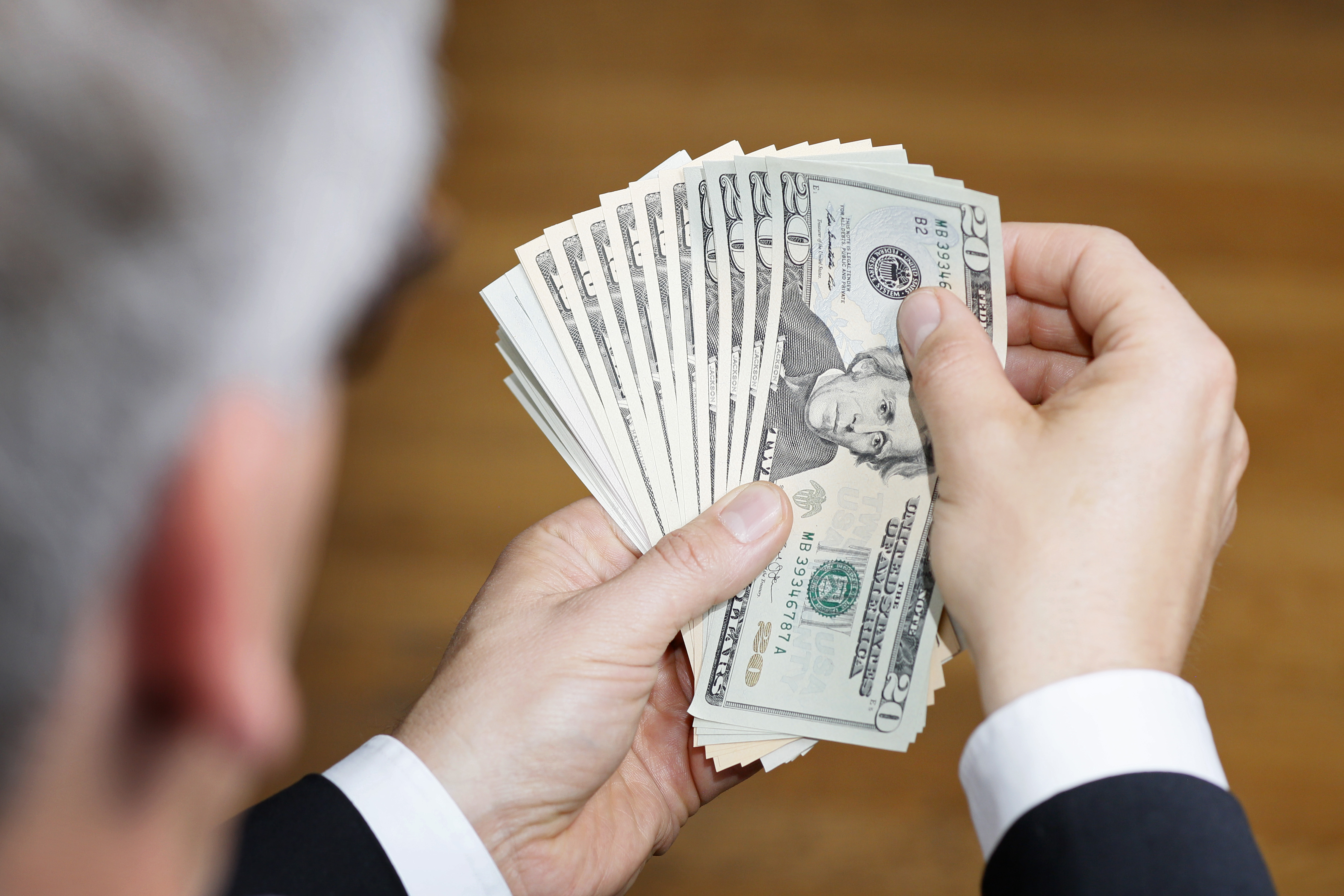 Businessman Holding US Dollars