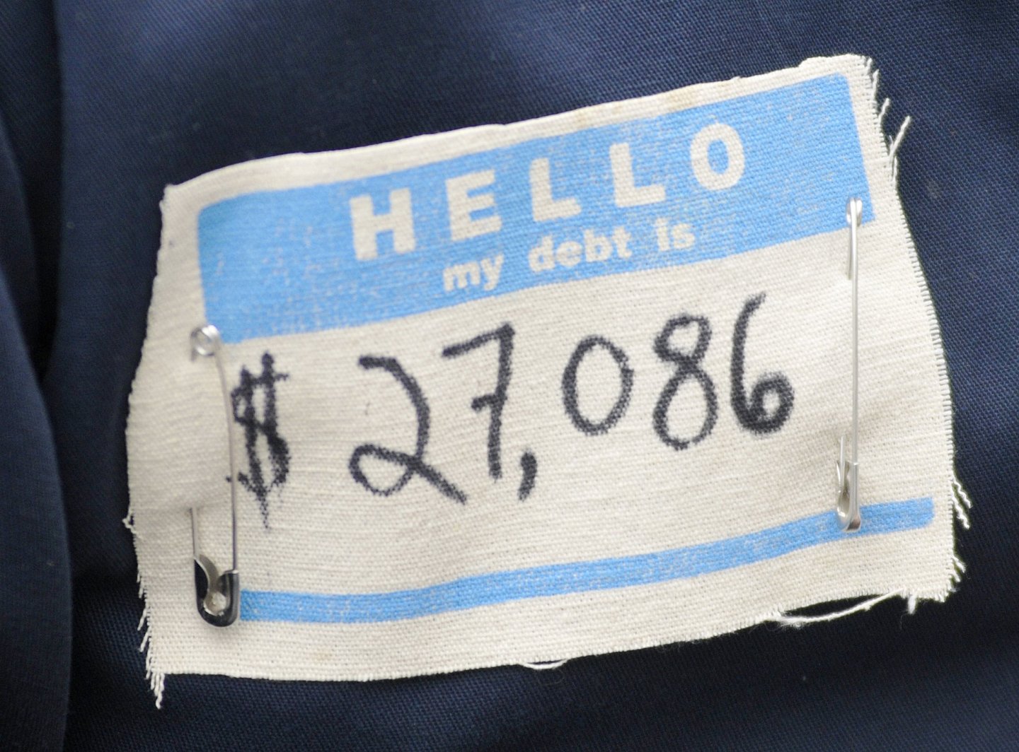 A tag worn by Jacob Lowry, a student at the University of Southern Maine as he and others protest st