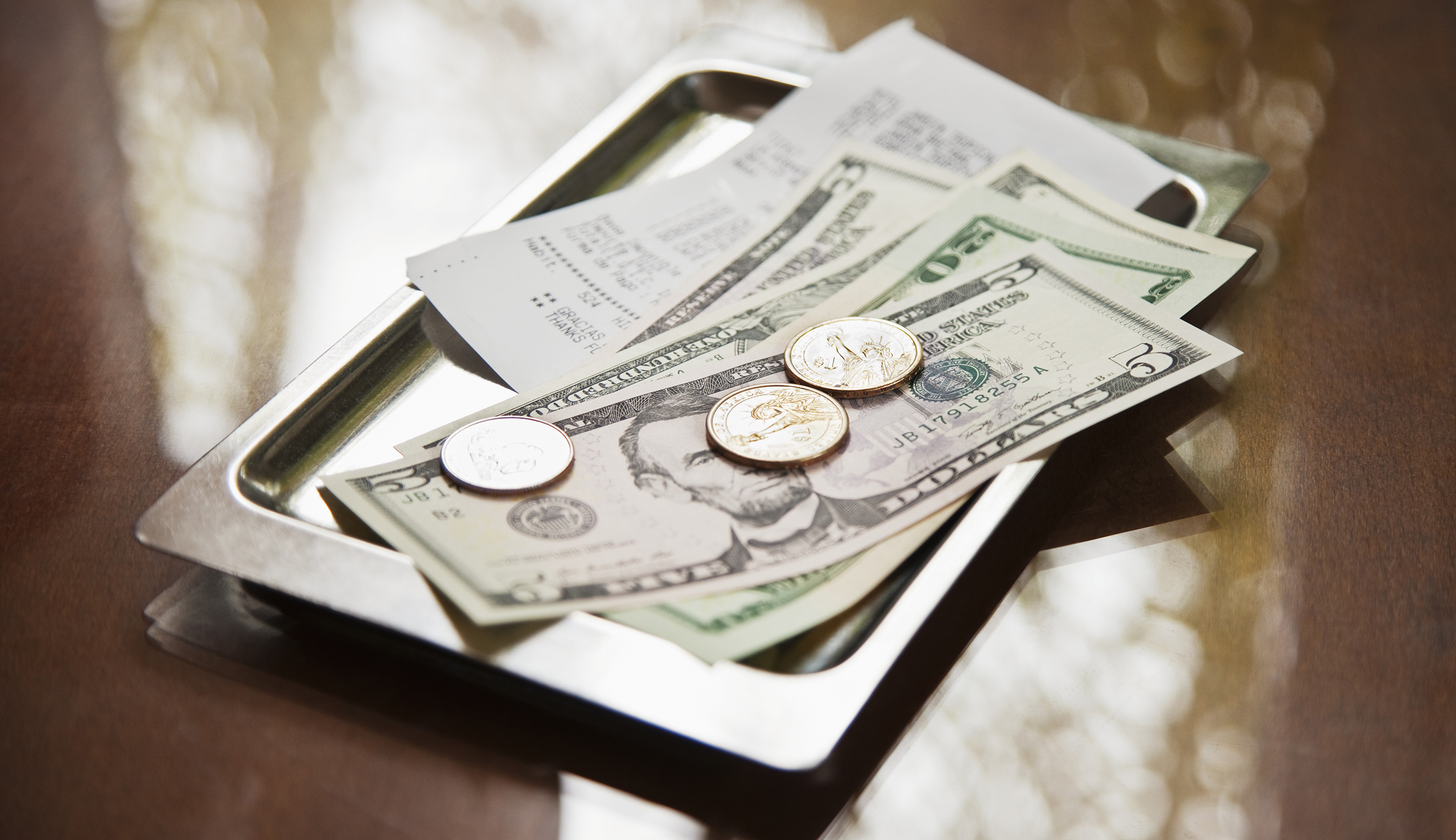 Tray with receipt and cash