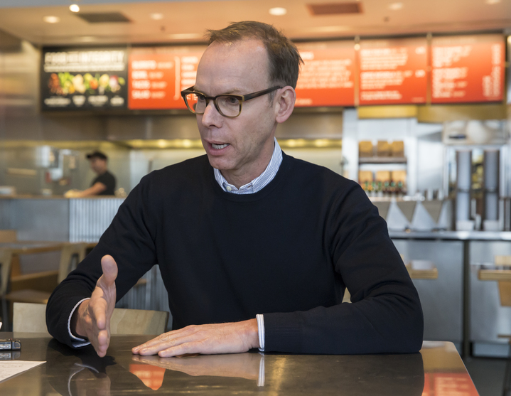 Chipotle Mexican Grill founder and CEO Steve Ells speaks during an interview with the Associated Press in a Chipotle restaurant on Tuesday Dec. 15, 2015, in Seattle. Ells was visiting restaurants in the Pacific Northwest to discuss new food safety protocols with employees after an E. coli outbreak sickened 50 people in the Northwest. (AP Photo/Stephen Brashear)