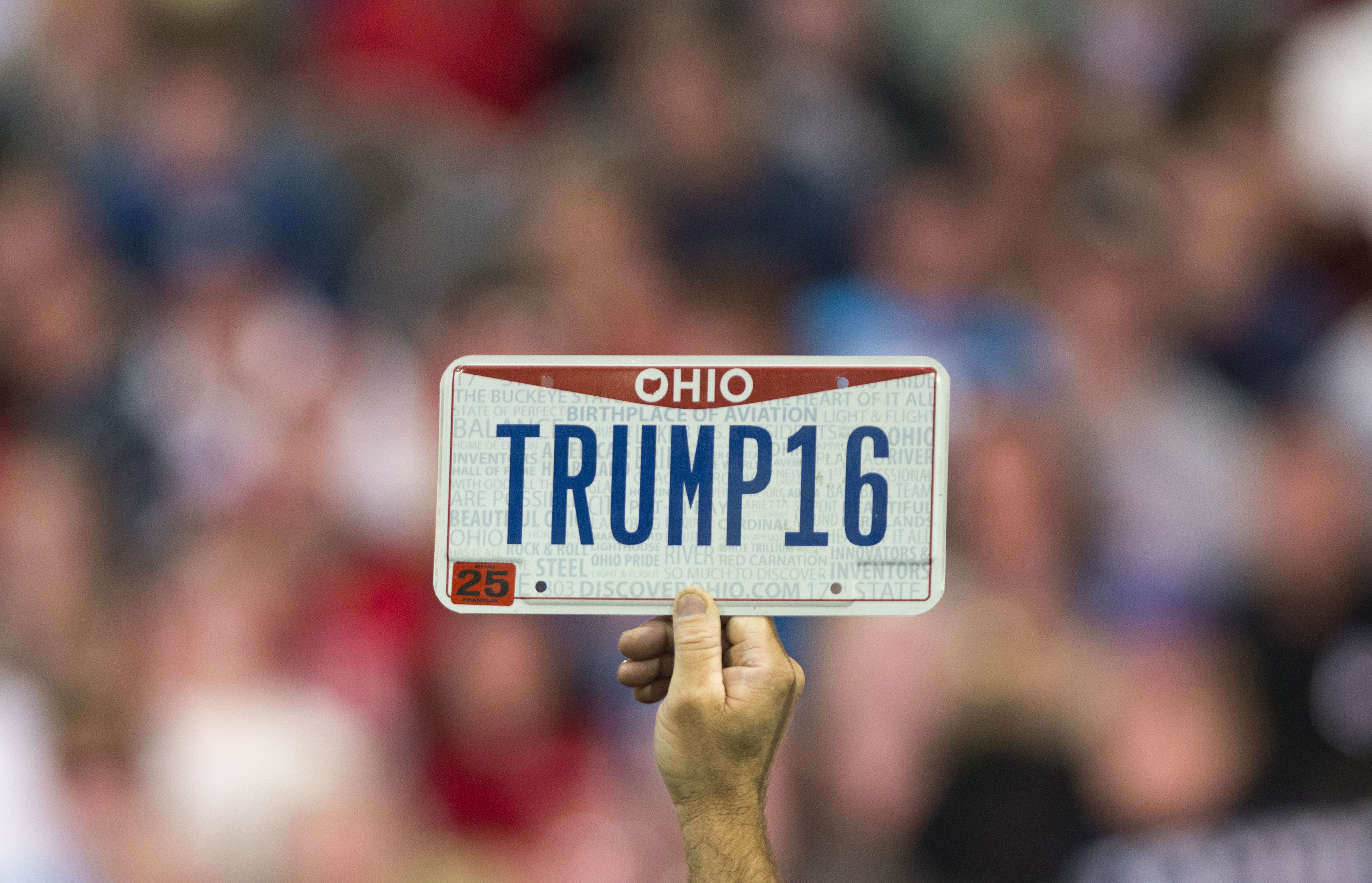 A Donald Trump supports holds up a sign at a campaign rally in Columbus, Ohio in November 2015.
