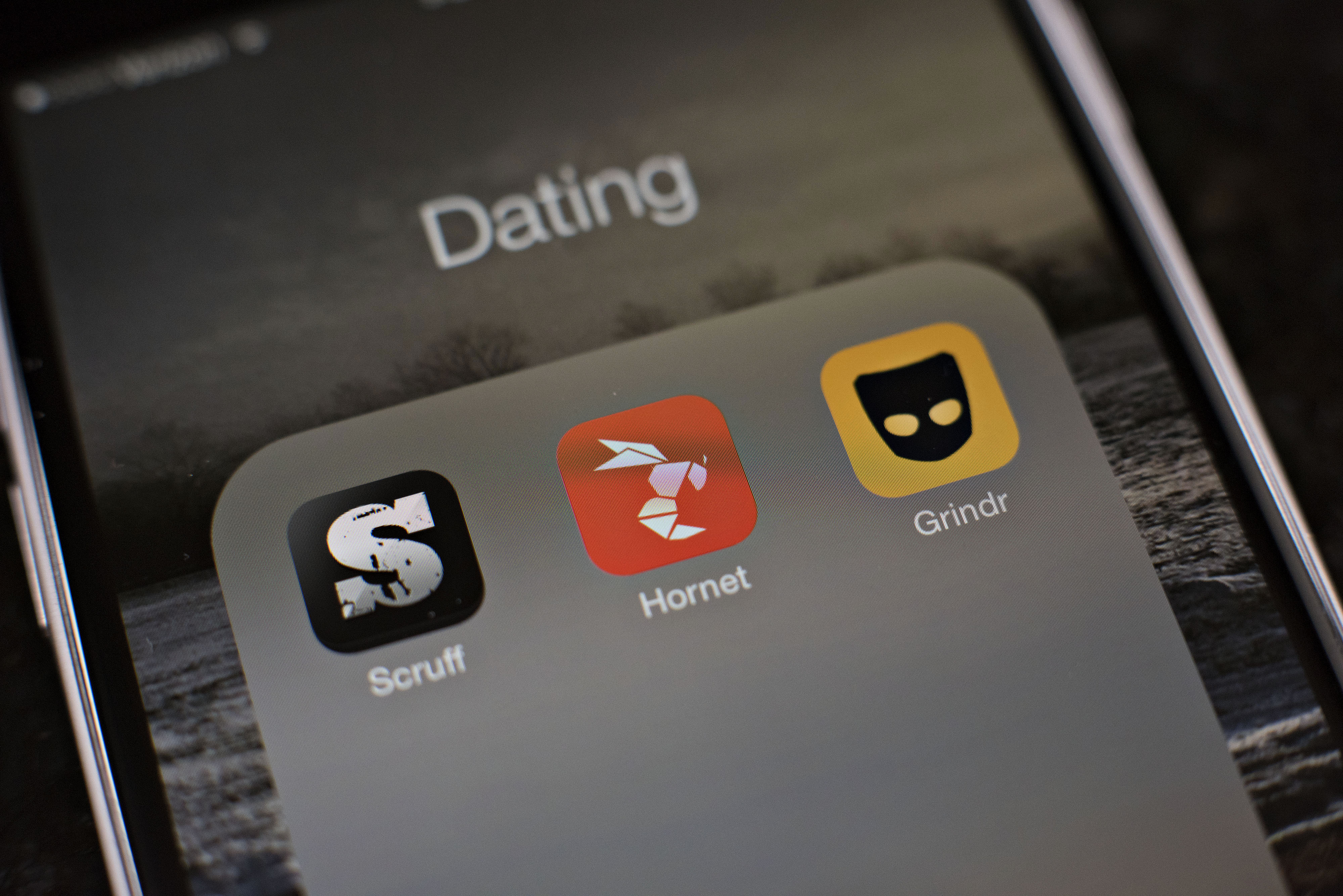 The gay dating apps Scruff, Hornet, and Grindr are displayed on an Apple Inc. iPhone 6 in Tiskilwa, Illinois, U.S., on Tuesday, Jan. 20, 2015. For gay men flocking to smartphone dating applications, making a connection increasingly comes with messages about HIV status, testing and drug regimens. Some apps let users declare their status, remind them to get tested and give locations of the closest clinics. Photographer: Daniel Acker/Bloomberg