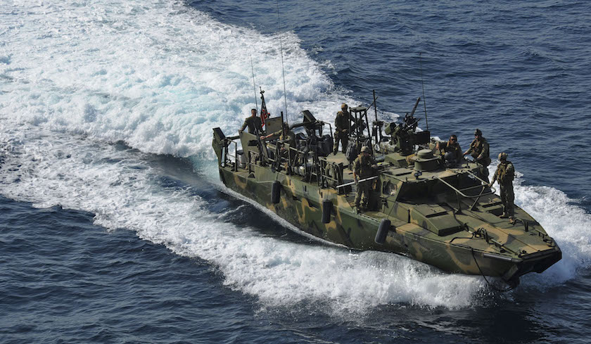 U.S. Navy handout photo of a riverine command boat from Riverine Detachment 23 operates during a maritime air support operations center exercise in the Arabia Gulf