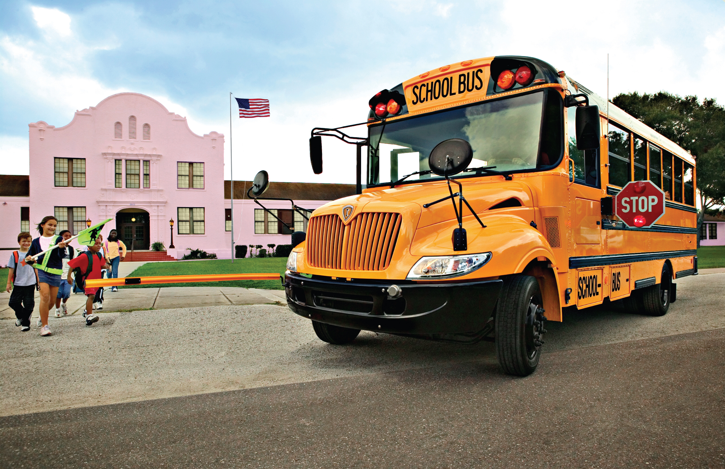 Schoolbus picking up children.