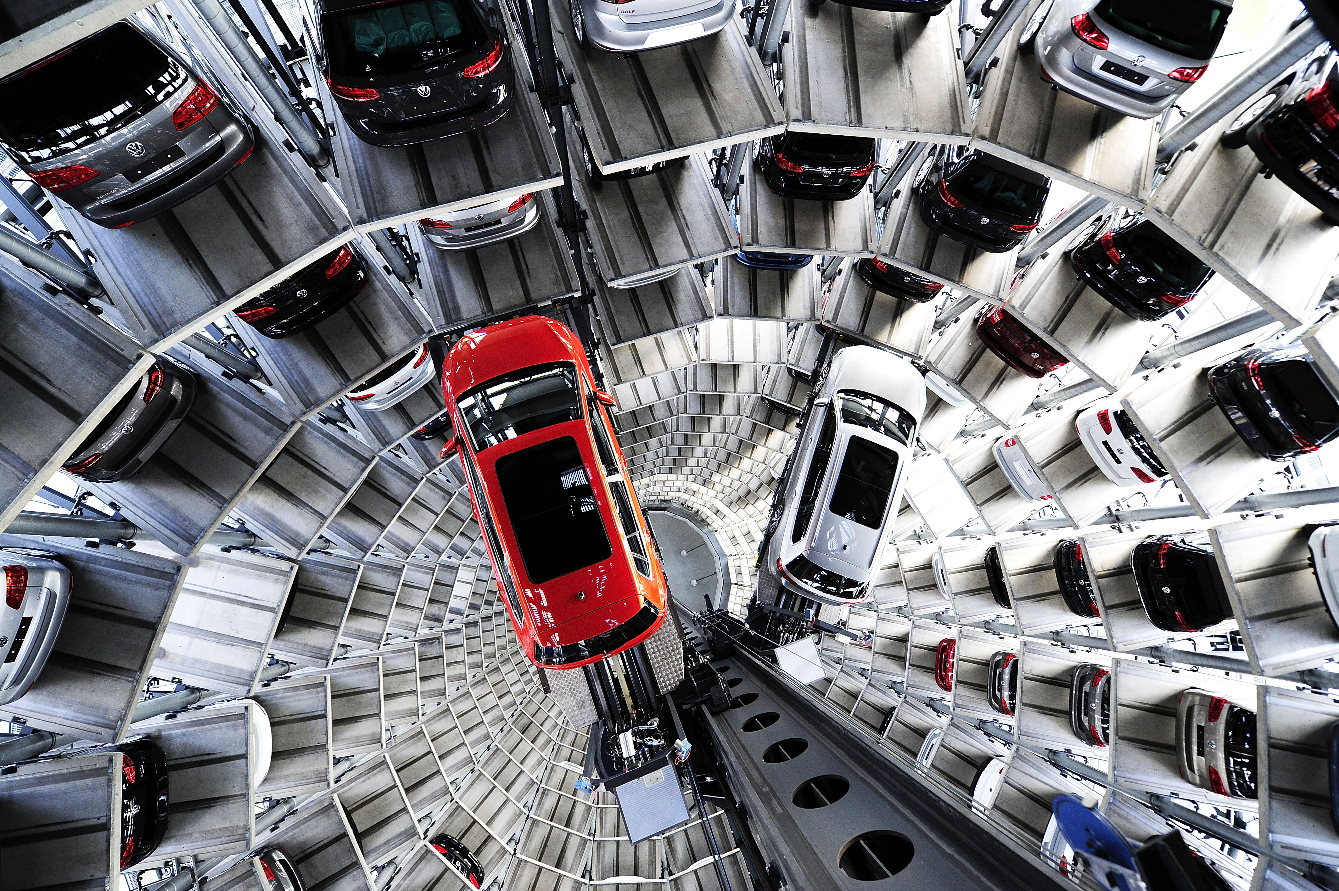 Brand new Volkswagen cars stand stored in a tower at the Volkswagen Autostadt complex near the Volkswagen factory on March 10, 2015 in Wolfsburg, Germany. Volkswagen is Germany's biggest carmaker and is scheduled to announce financial results for 2014 later this week. Customers who buy a new Volkswagen in Germany have the option of coming to the Autostadt customer service center in person to pick up their new car.