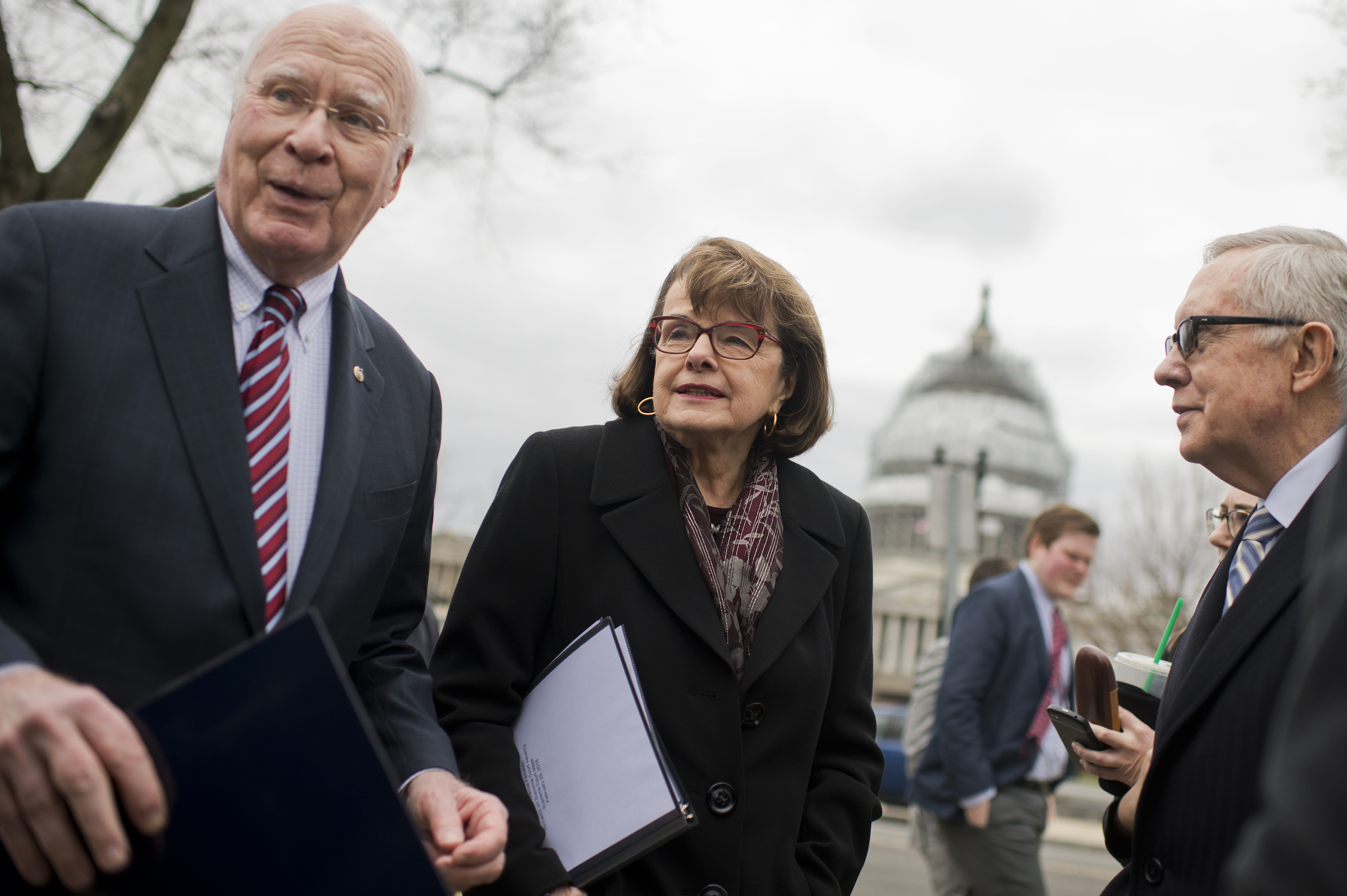 UNITED STATES - FEBRUARY 25: From left, Sens. Patrick Leahy, D-Vt., Dianne Feinstein, D-Calif., and Senate Minority Leader Harry Reid, D-Nev., along with other Senate Democrats hold a news conference outside of the Supreme Court to call on Senate Republicans to allow a hearing and vote on President Obama's nominee to replace the late Justice Antonin Scalia, February 25, 2016. (Photo By Tom Williams/CQ Roll Call)