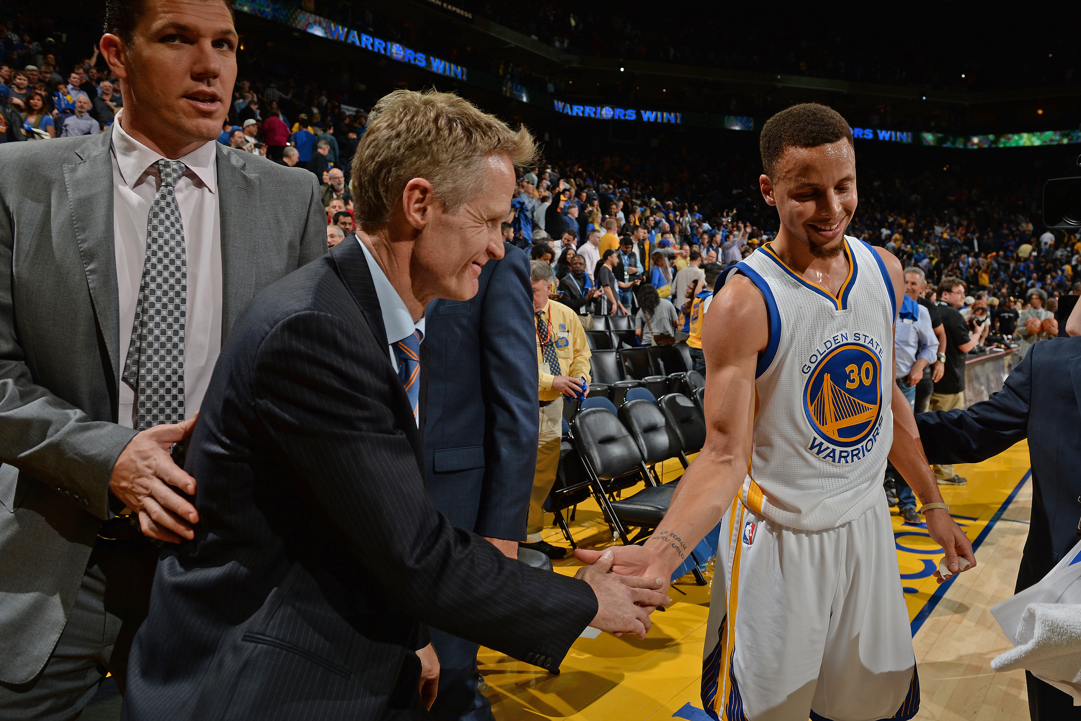 Caption:OAKLAND, CA - MARCH 3: Steve Kerr and Stephen Curry #30 of the Golden State Warriors shake hands after the game against the Oklahoma City Thunder on March 3, 2016 at ORACLE Arena in Oakland, California. NOTE TO USER: User expressly acknowledges and agrees that, by downloading and or using this photograph, user is consenting to the terms and conditions of Getty Images License Agreement. Mandatory Copyright Notice: Copyright 2016 NBAE (Photo by Garrett Ellwood/NBAE via Getty Images)