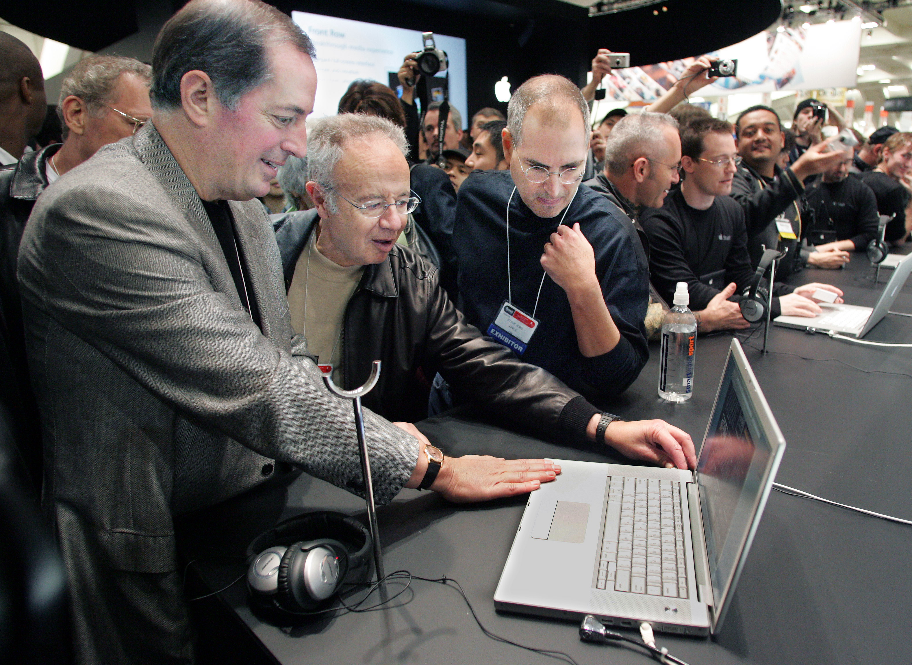 Apple CEO Jobs shows Intel CEO Otellini and former CEO Grove new MacBook Pro at Macworld
