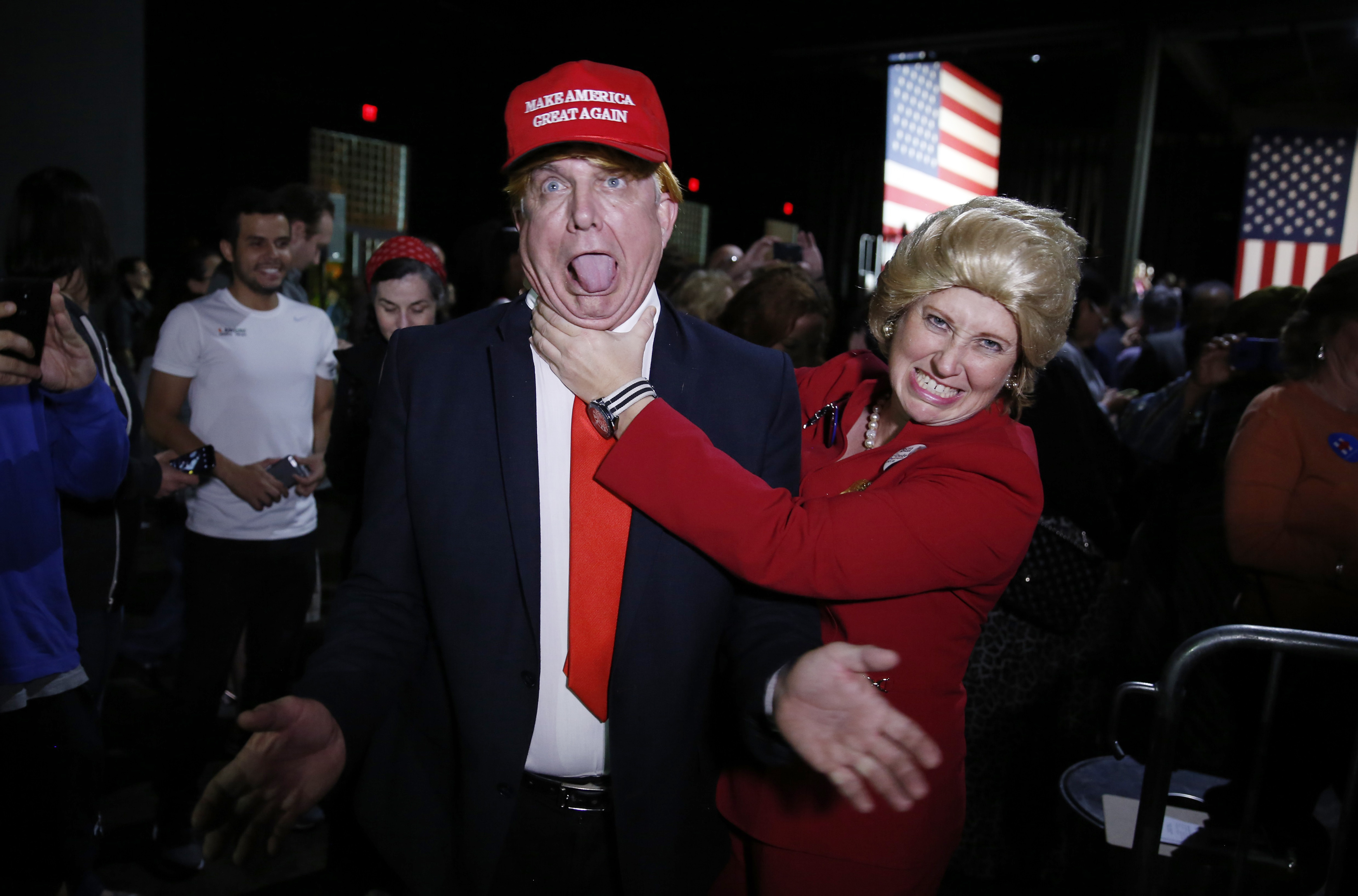 Supporters of Democratic U.S. presidential candidate Hillary Clinton, who came to her rally in costume as Republican presidential candidate Trump and as Mrs. Clinton attend her Super Tuesday night party in Miami