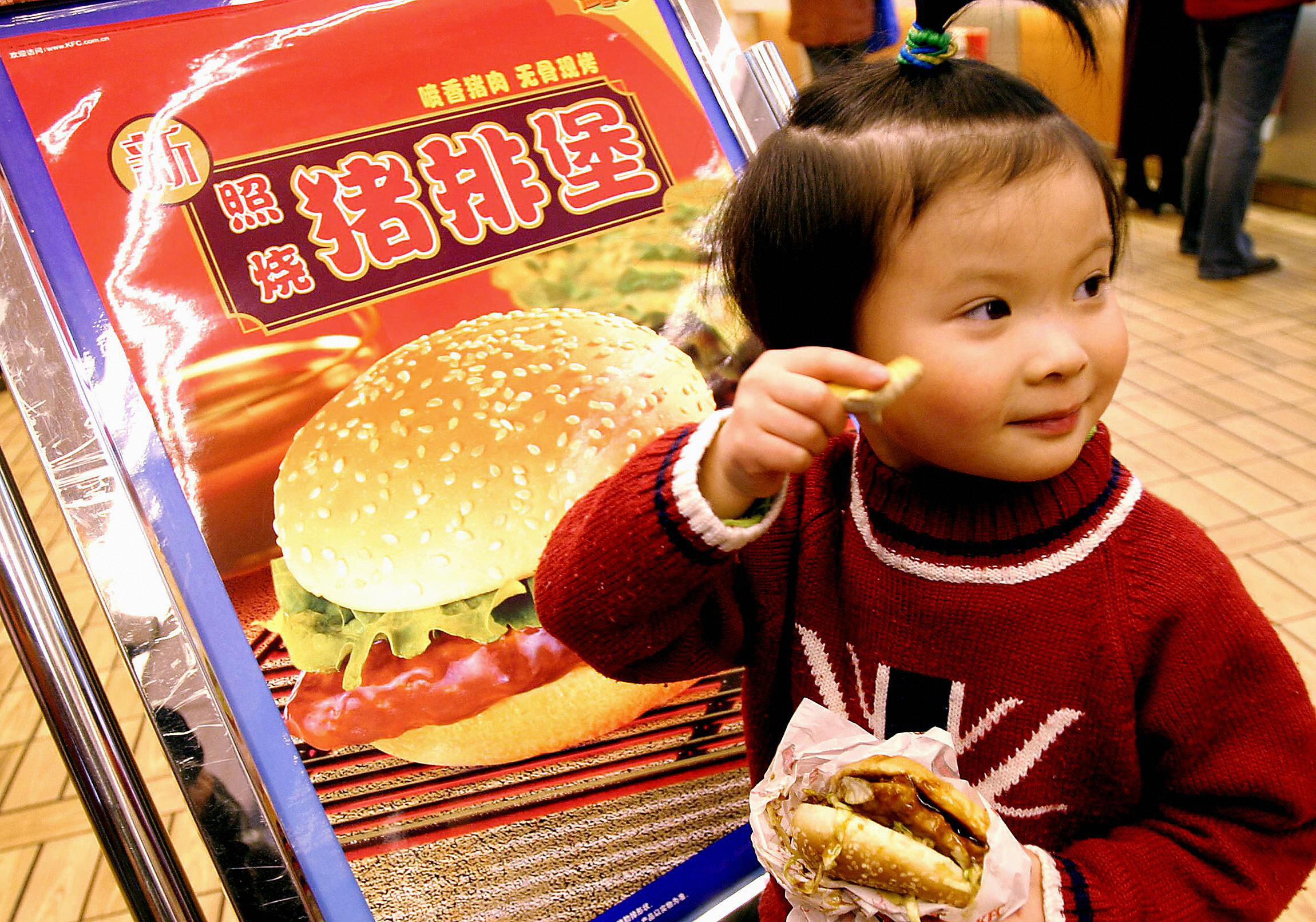 A young girl tries out the new US fastfo