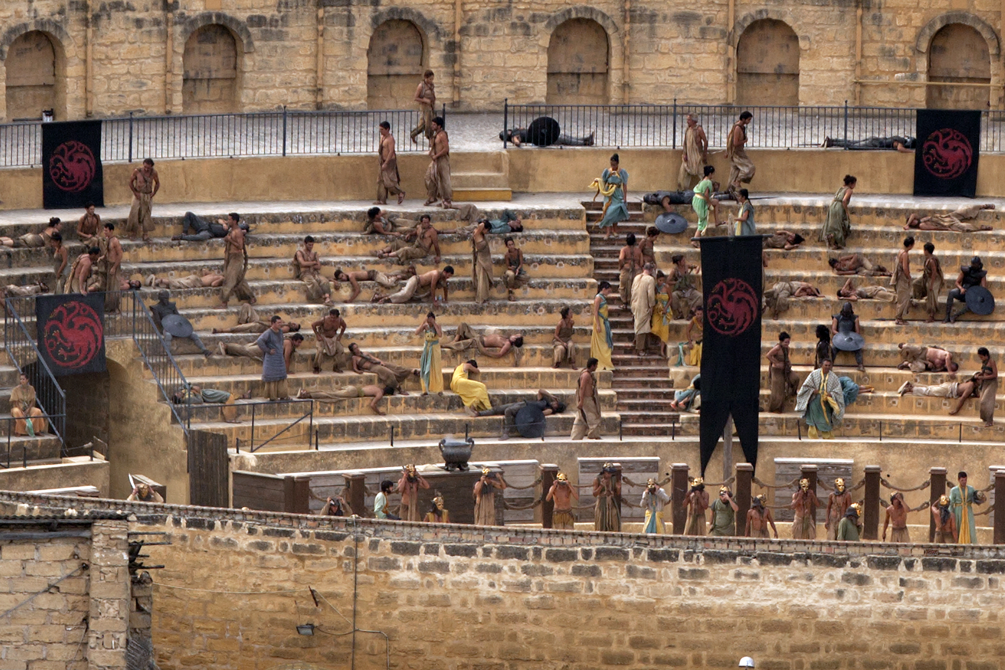 Extras take part in the filming of the fifth season of the HBO TV series "Game of Thrones'" inside a bullring in downtown Osuna