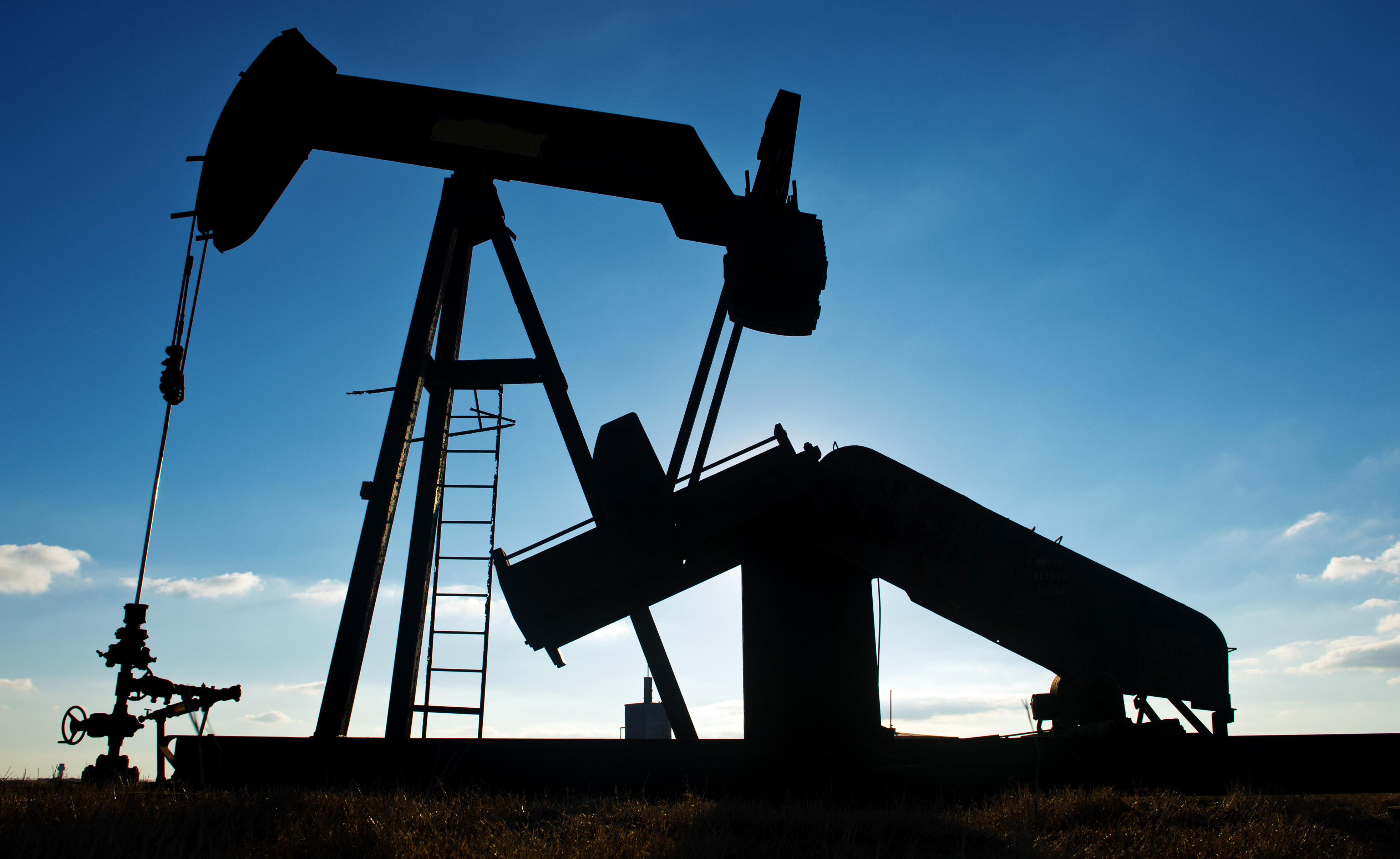 Views Of Tankers & Refineries As Oil Trades Near 12-Year Low