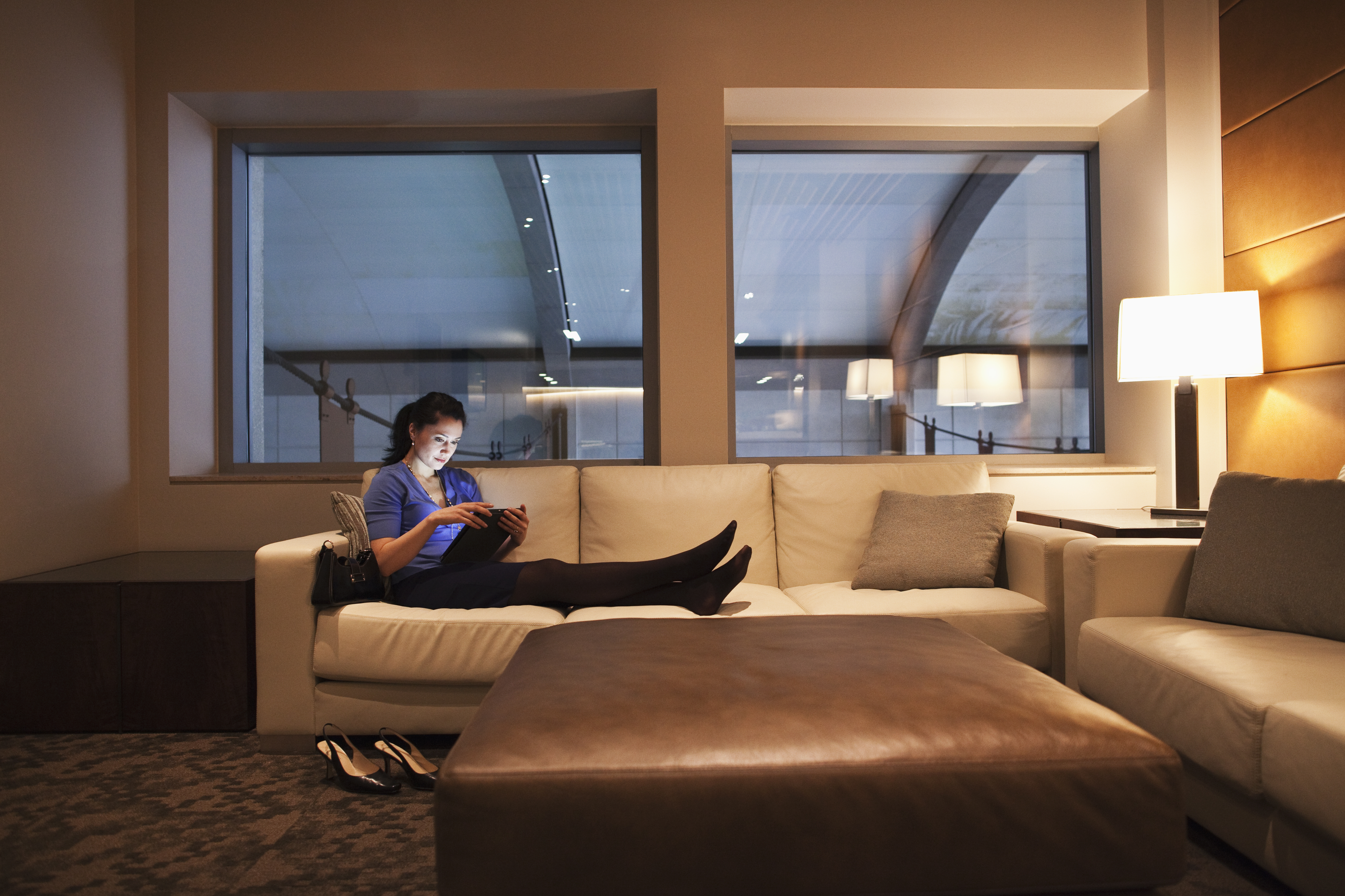 Mixed race businesswoman using tablet computer