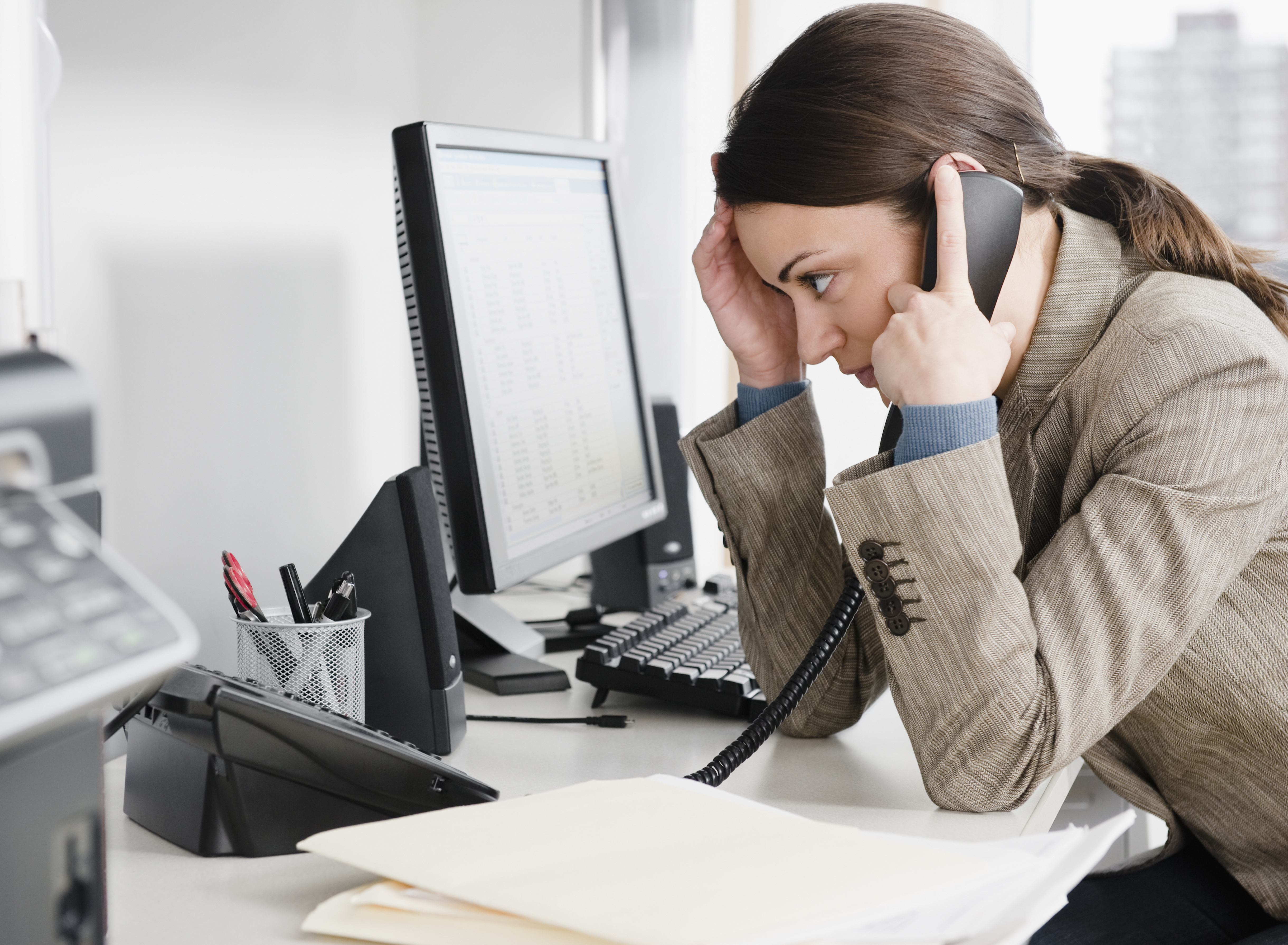 Businesswoman talking on the phone in office