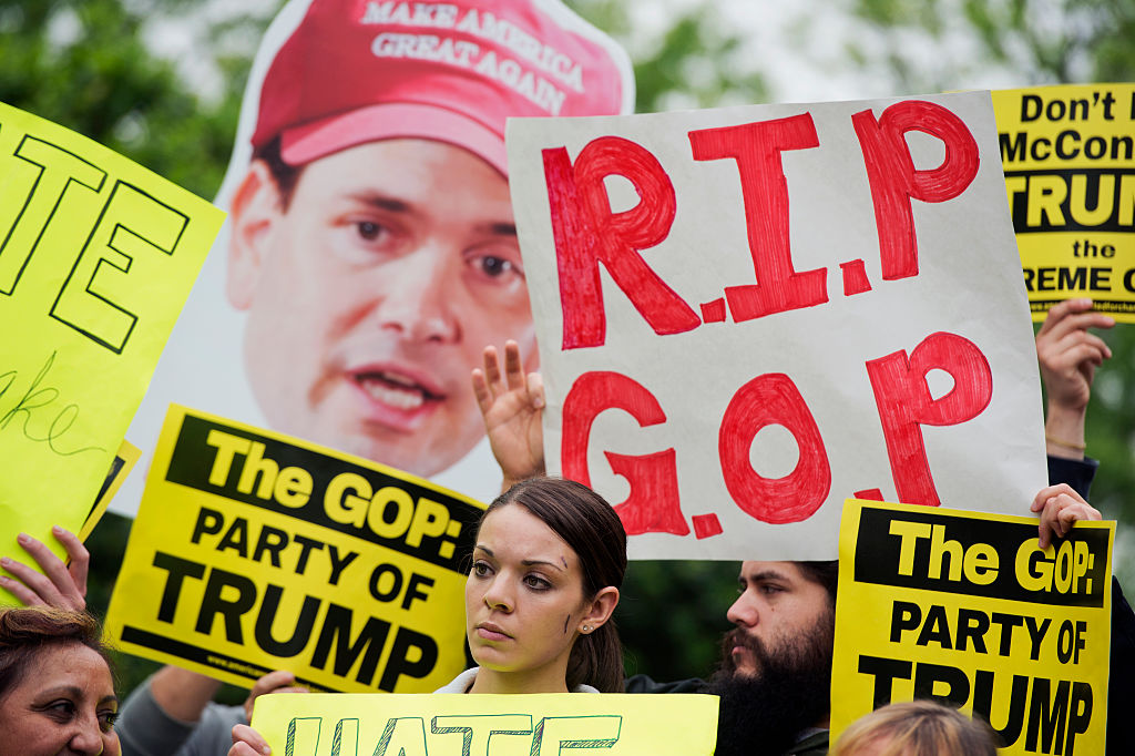 UNITED STATES - MAY 12: Groups of protesters, including United We Dream, demonstrate outside of the National Republican Senatorial Committee during a meeting between Republican presidential candidate Donald Trump, Senate Majority Leader Mitch McConnell, R-Ky., and Senate republican leaders, May 12, 2016. (Photo By Tom Williams/CQ Roll Call)