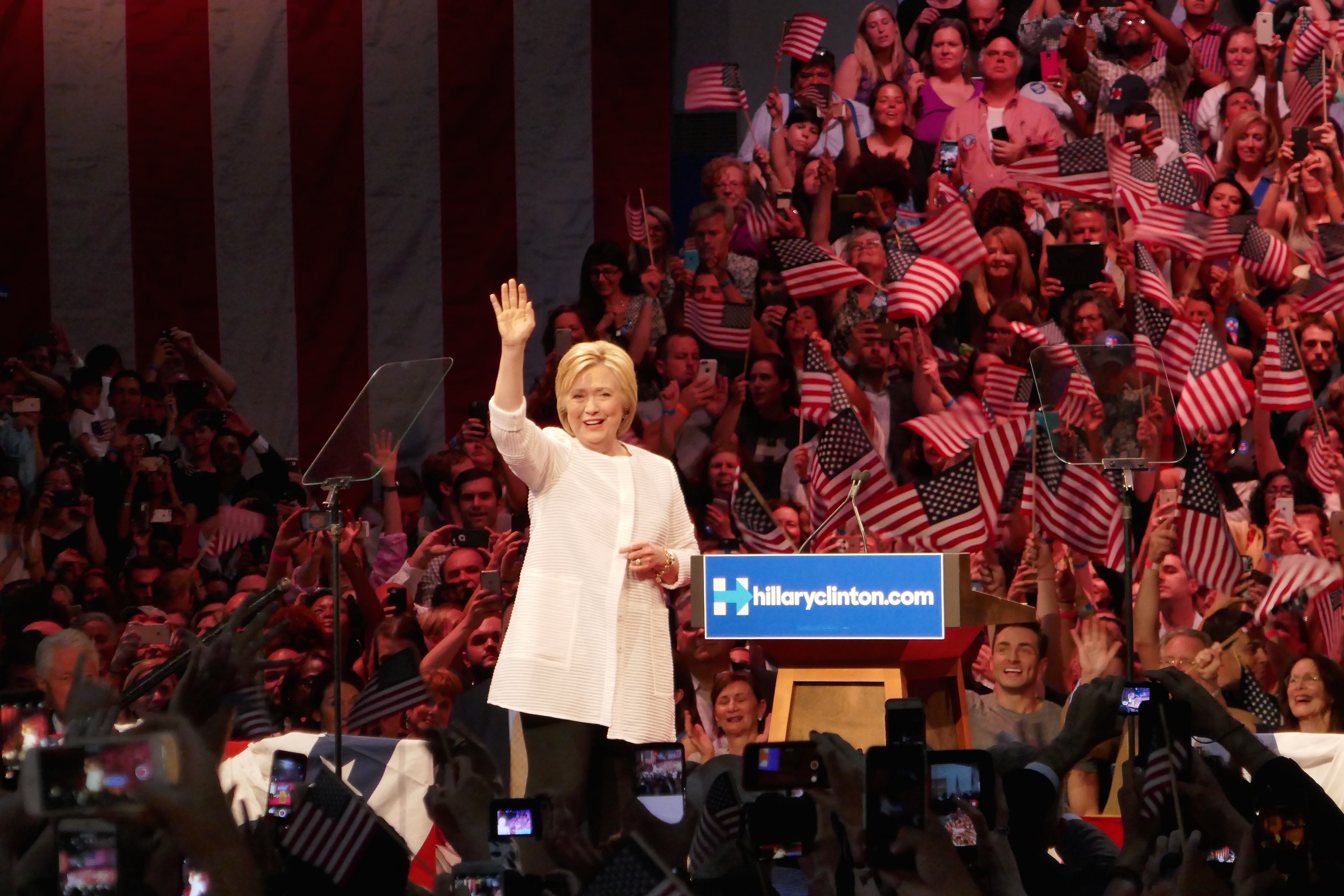 Clinton claims nomination as primaries near end