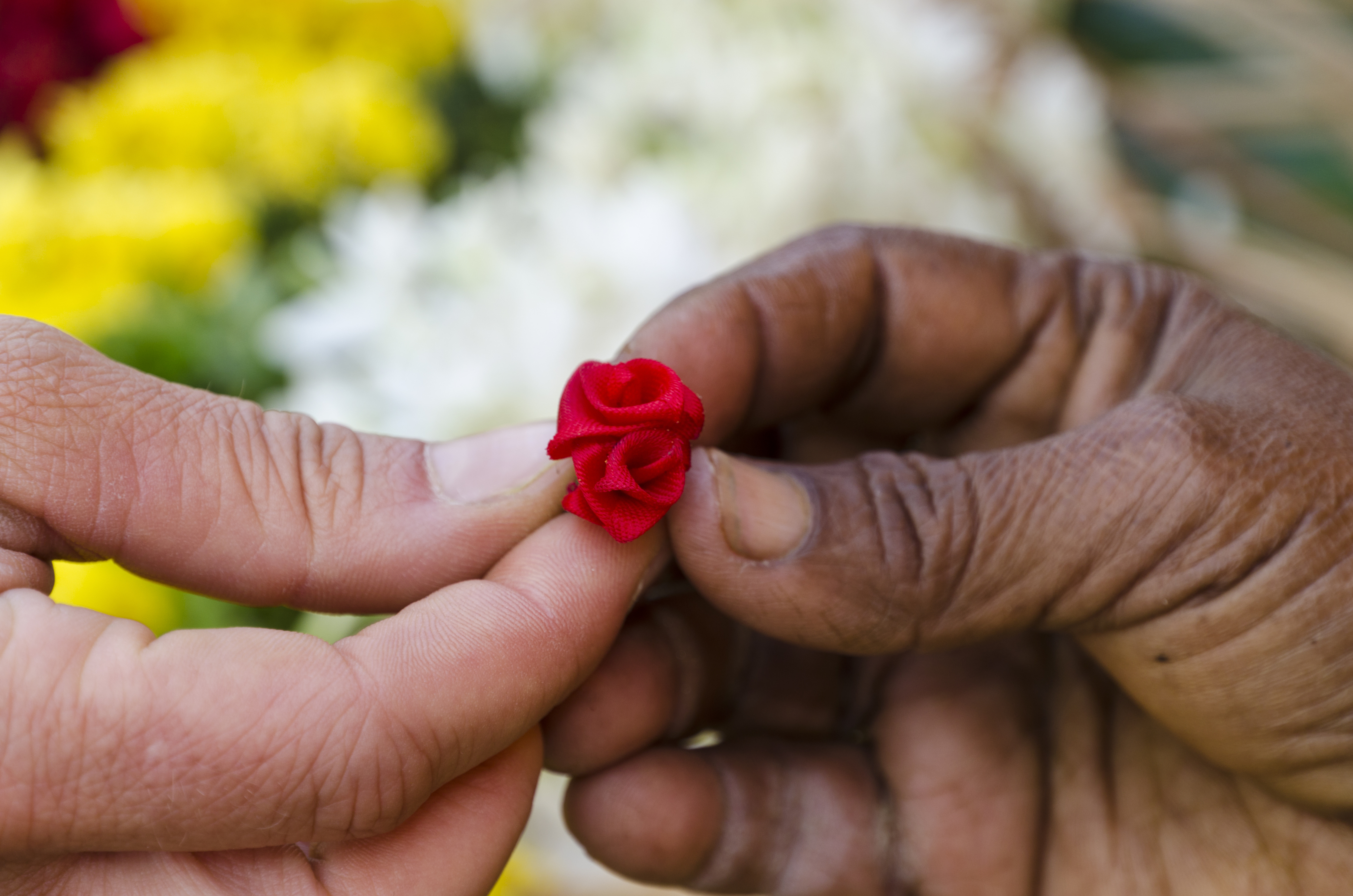 Little artificial flower given to a tourist for gift as a