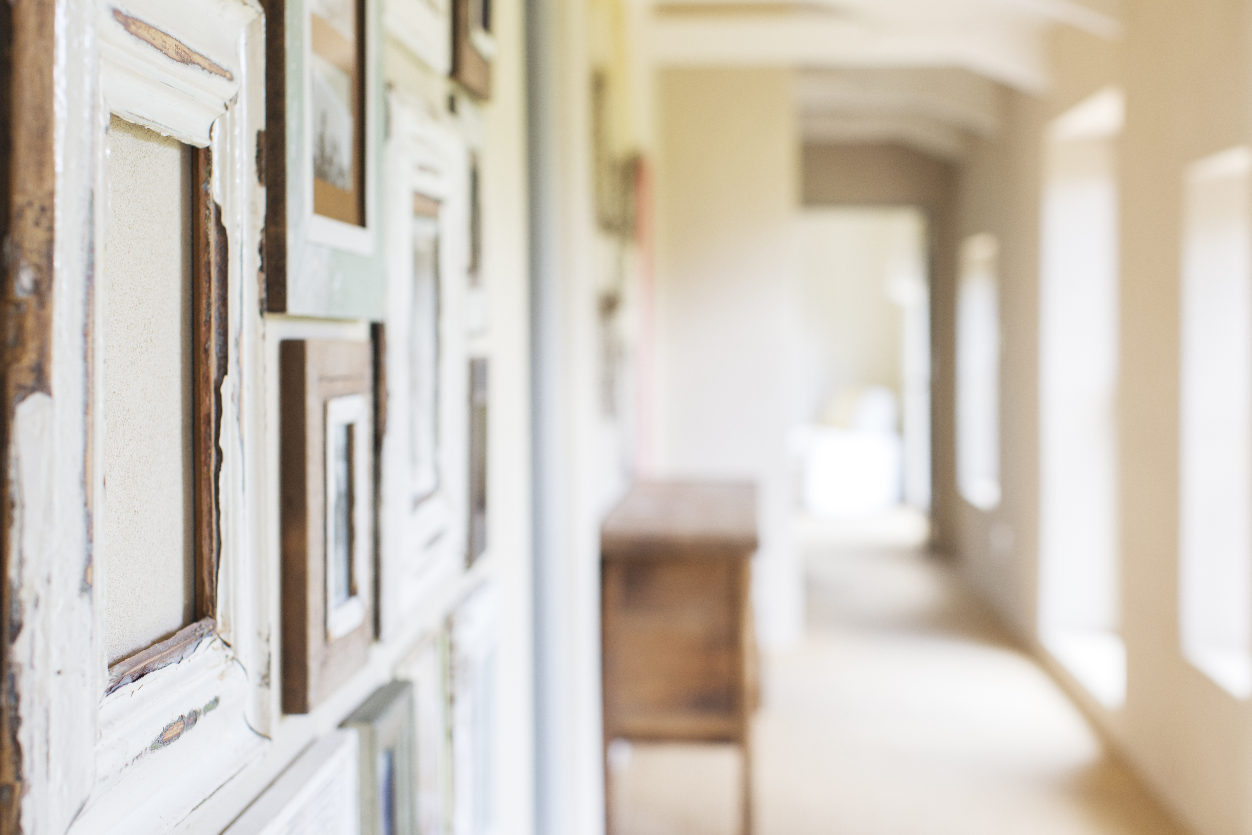 Decorative wall frames in rustic hallway