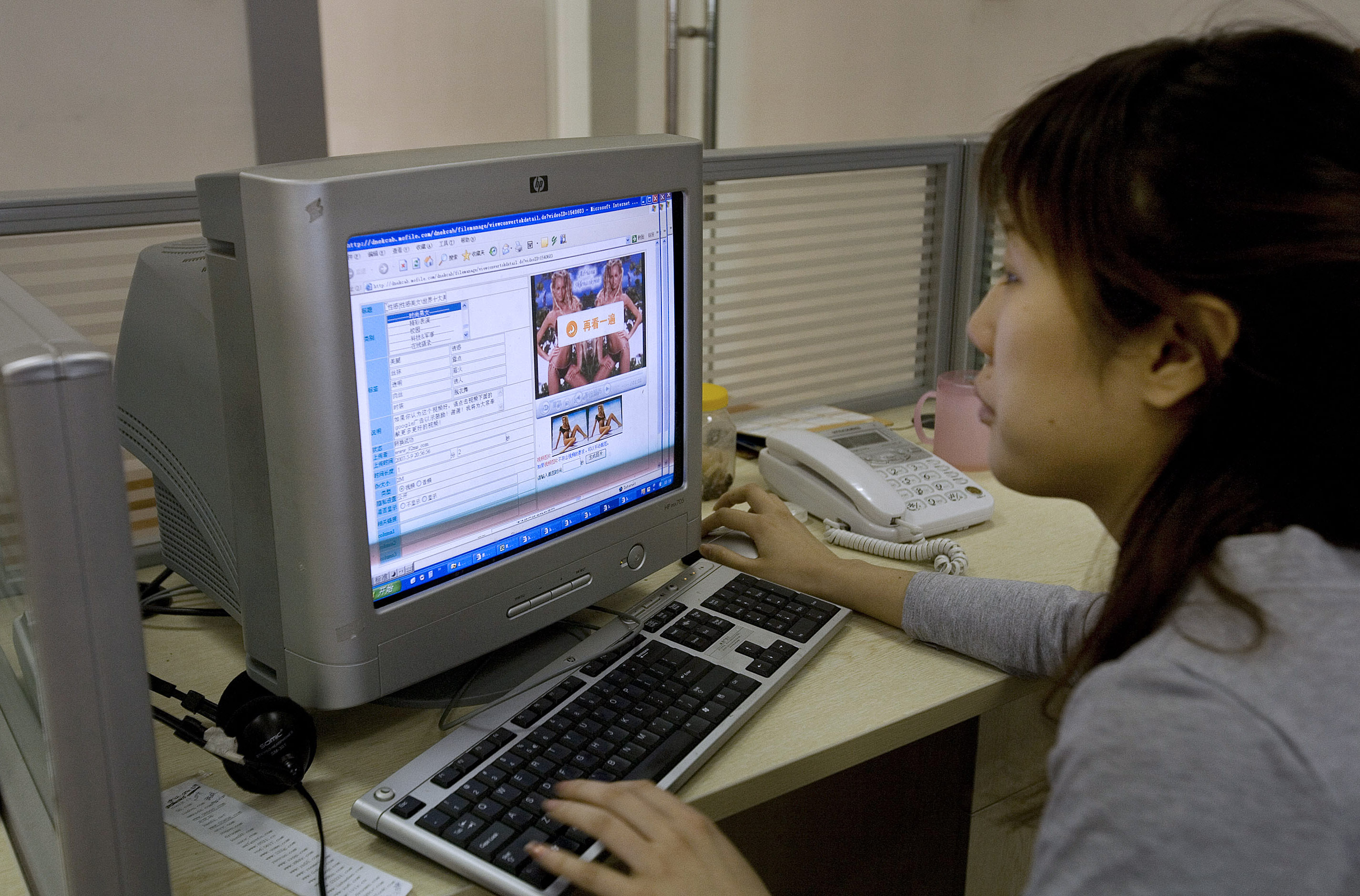 Editors work to censor web content at the office of Mofile.c