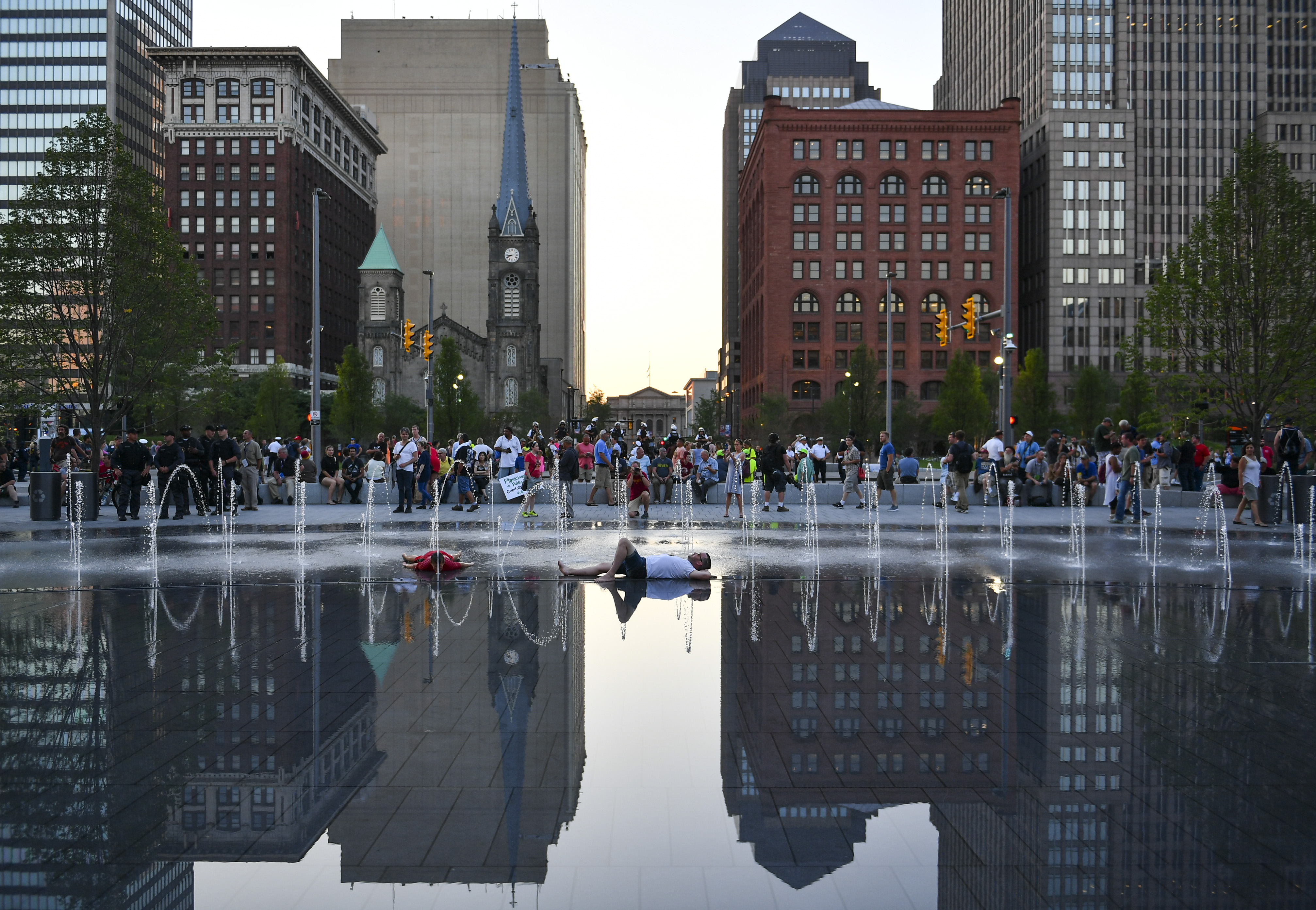 CLEVELAND, OH - JULY 20: A man lies in the fountain at Public S