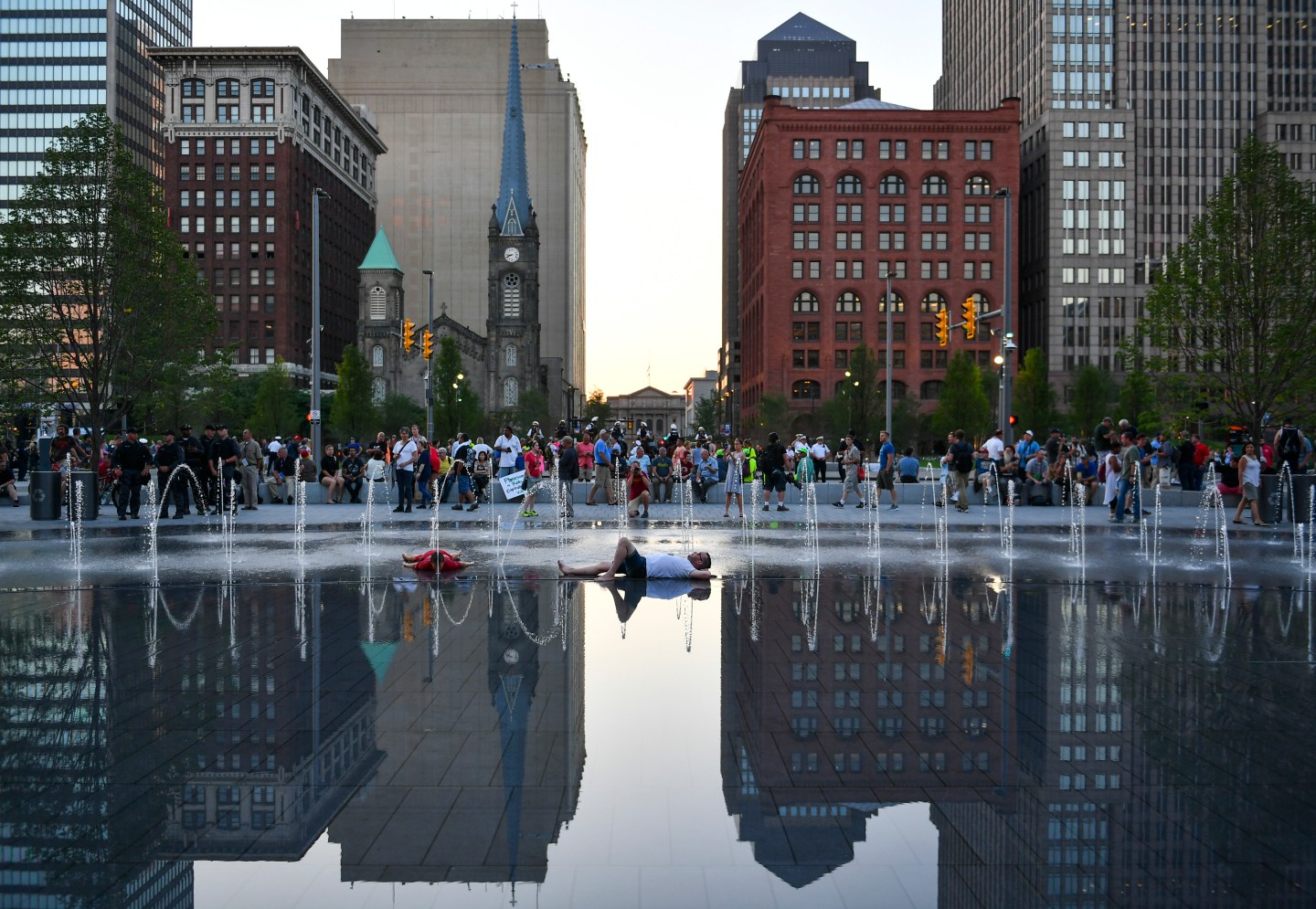 CLEVELAND, OH - JULY 20: A man lies in the fountain at Public S