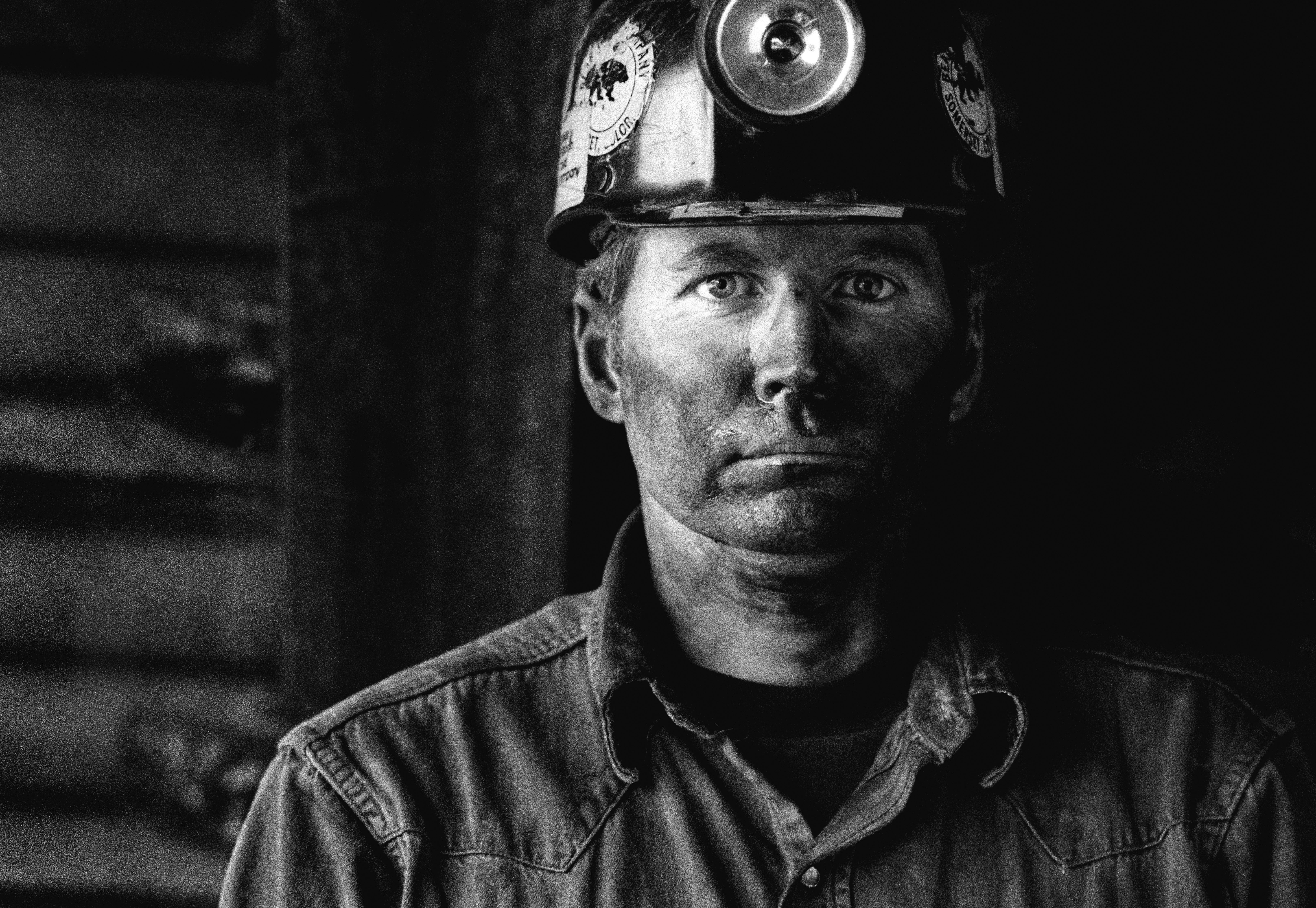 Coal miner covered in coal dust