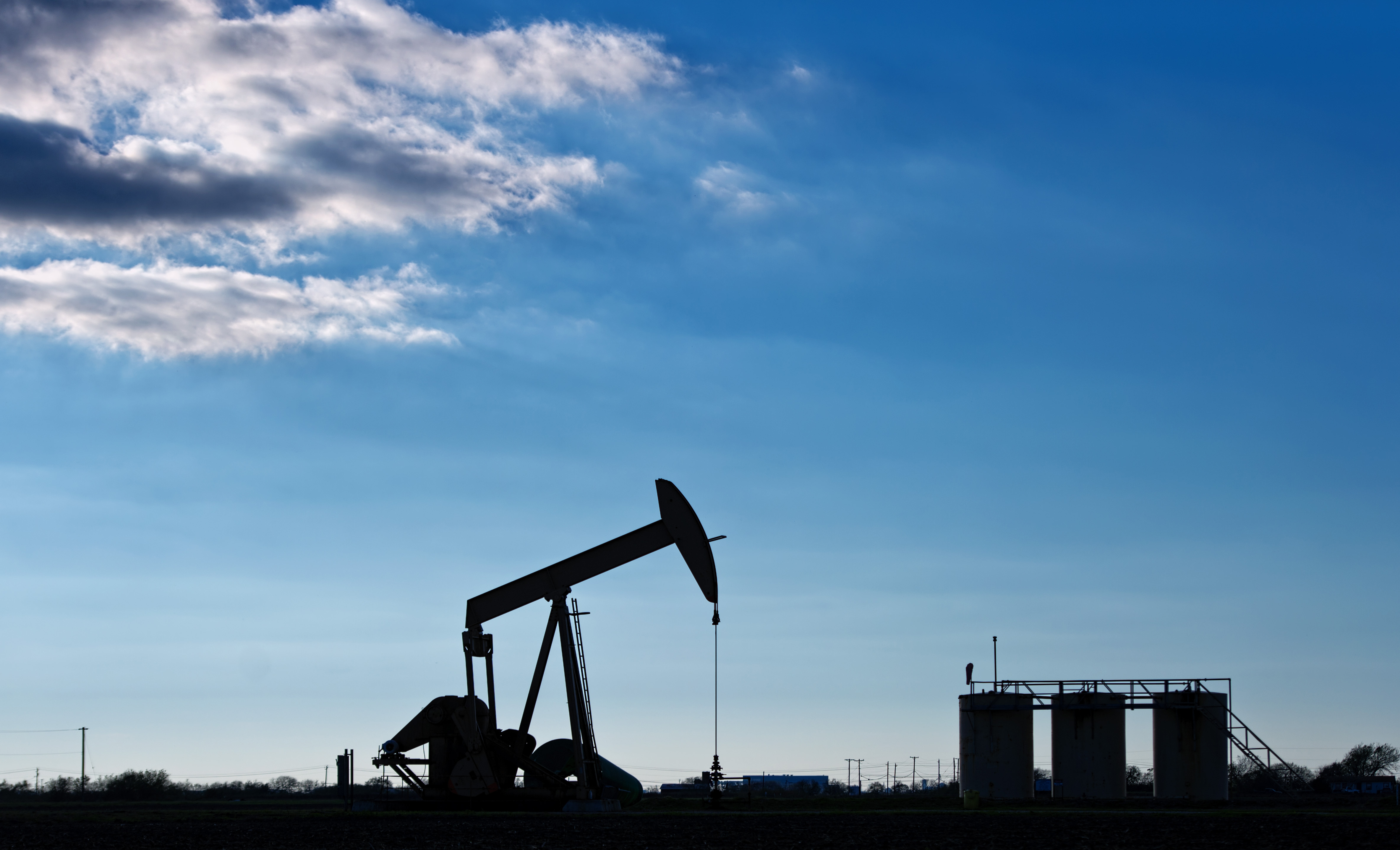 Views Of Tankers & Refineries As Oil Trades Near 12-Year Low