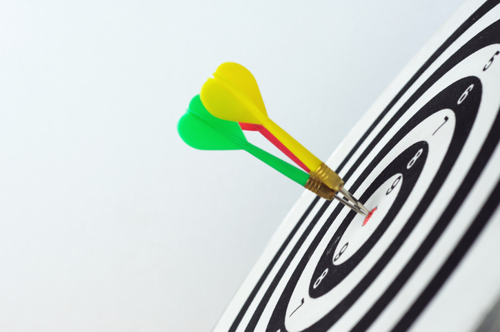 Three darts on dartboard