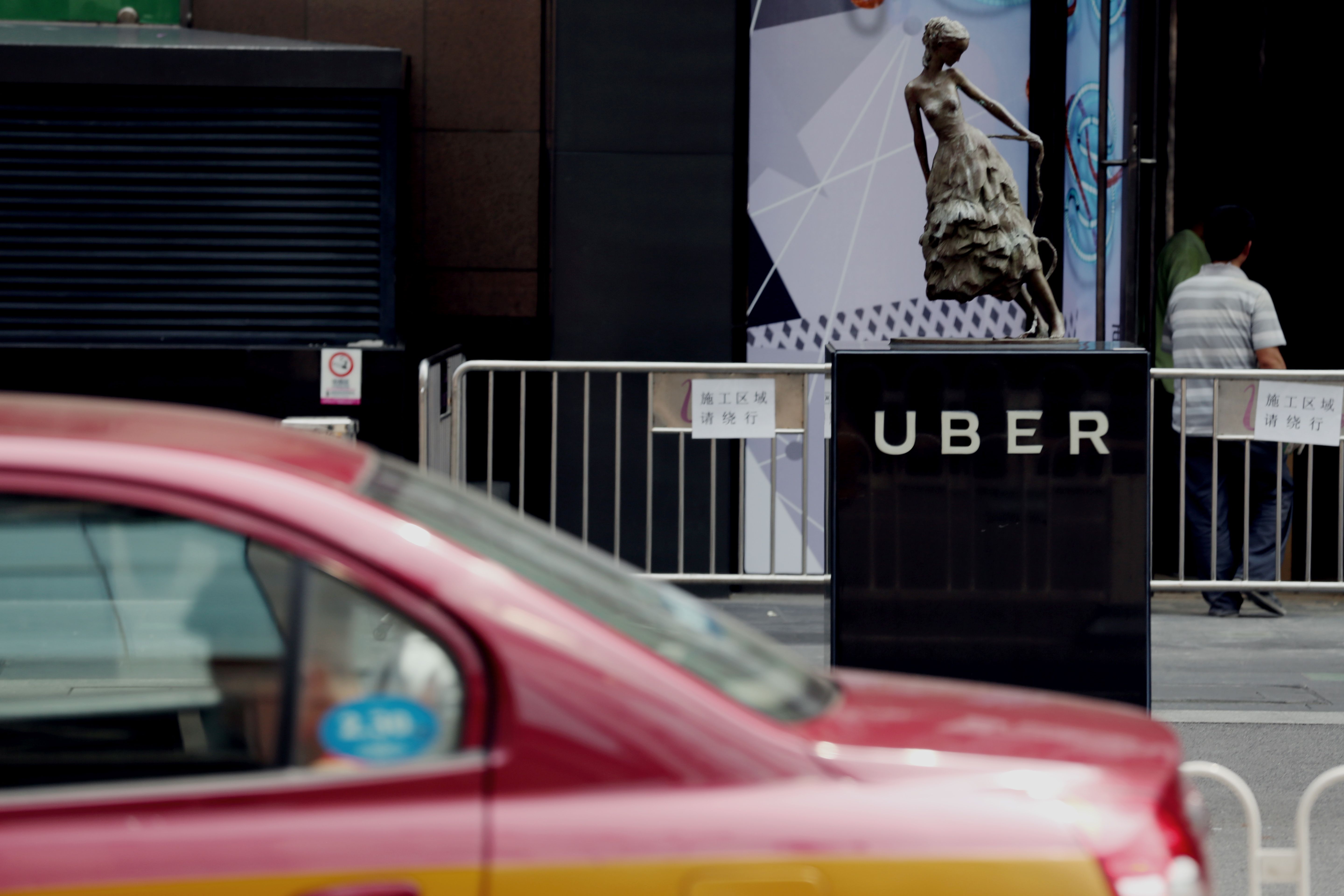 CHINA-US-TRANSPORT-UBER-DIDI-MERGER