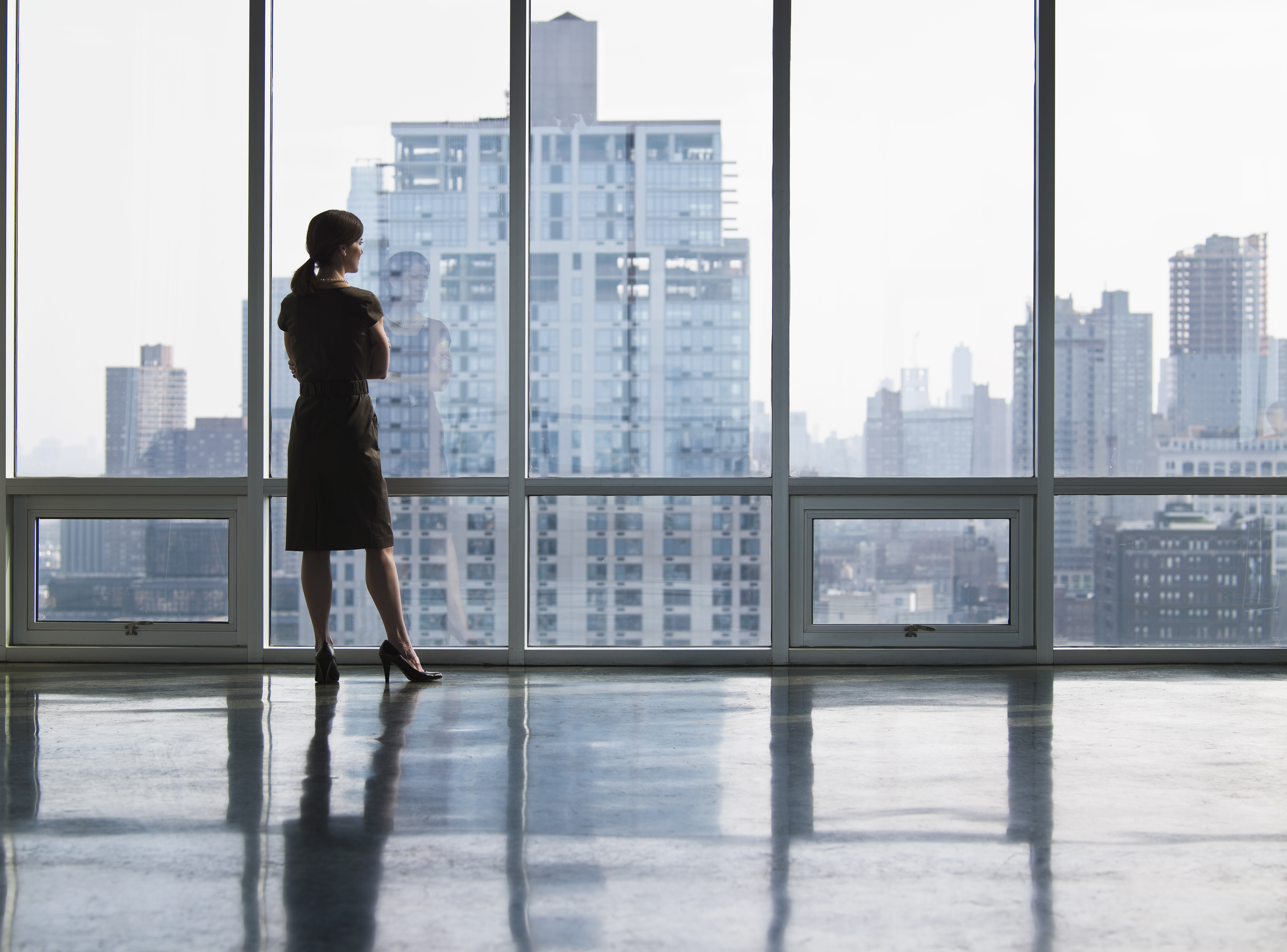Business woman looking out window