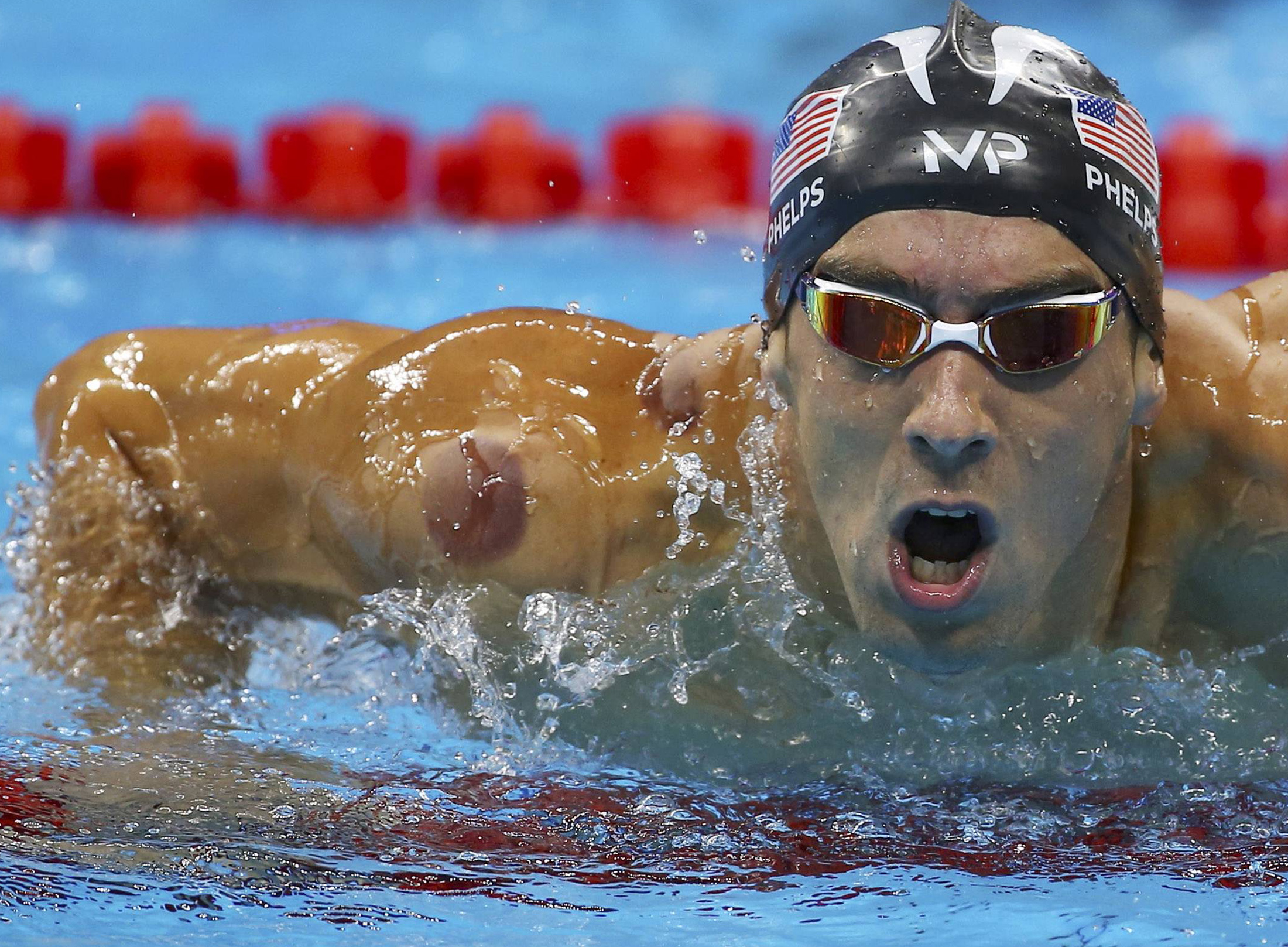Michael Phelps of the US is seen with a red cupping mark on his shoulder as he competes in the Men's 4 x 100m Freestyle Relay Final at the 2016 Rio Olympics in Rio de Janeiro