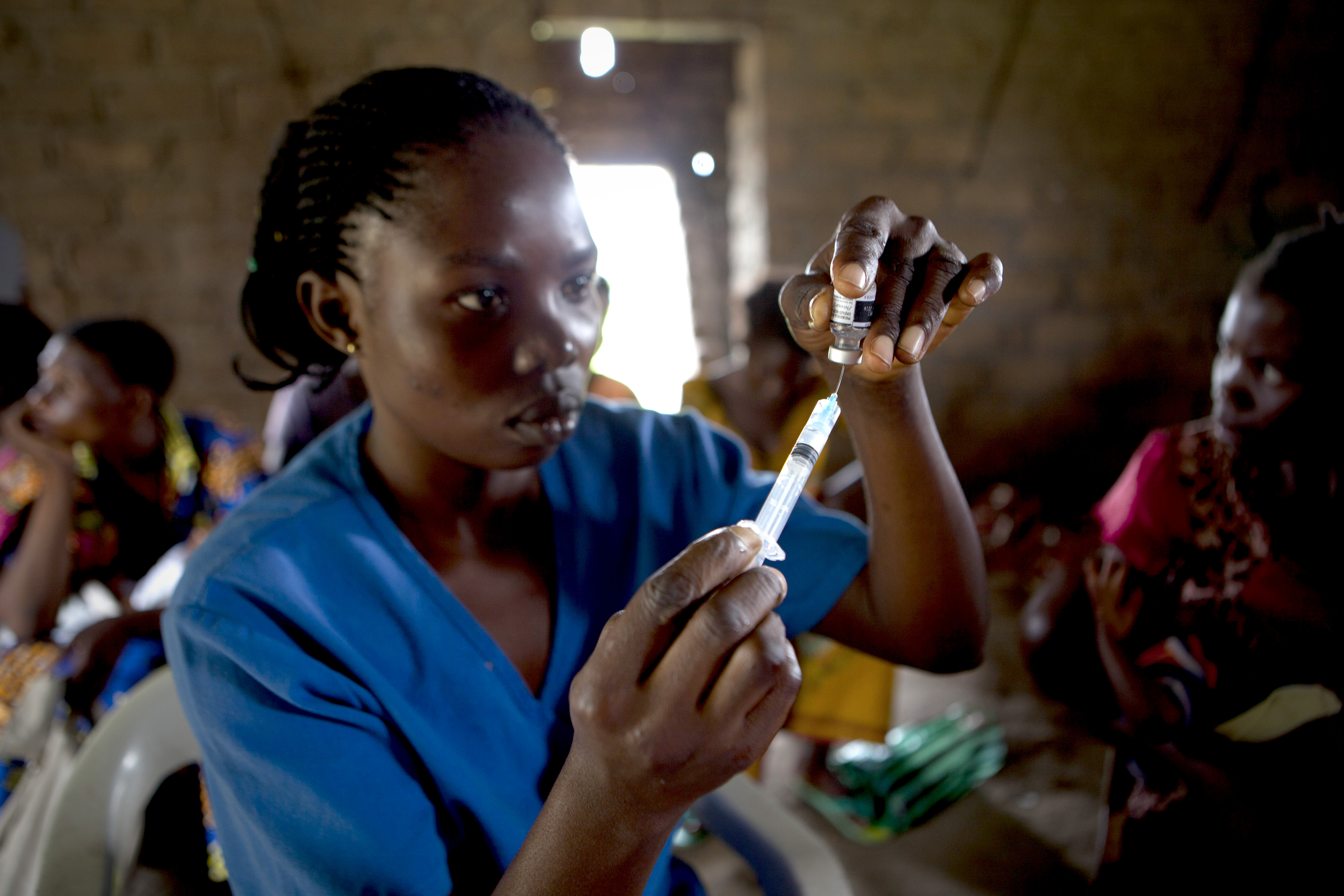 A health worker vaccinated children at Ba Kwasumba Health Centre, Cilundu Health Zone, Kasai Oriental Province, DRC. Save The Children and GSK have together successfully created a vaccination programme against preventable diseases for children under 5.GSK’s PRIME project beginning in 2014 will provide essential free medicines and equipment to under equipped Health Centres in DRC. GSK PRIME will improve access to health services through refurbishing health centers, training, equipping and supporting frontline health workers and driving a demand for health services from communities where children currently have no access to health care. DRC is one of the worst countries in the world to be a mother or a child. One in five children die of preventable diseases before reaching their 5th birthday. PRIME will contribute to the wider Save The Children Health Signature Programme in DRC.