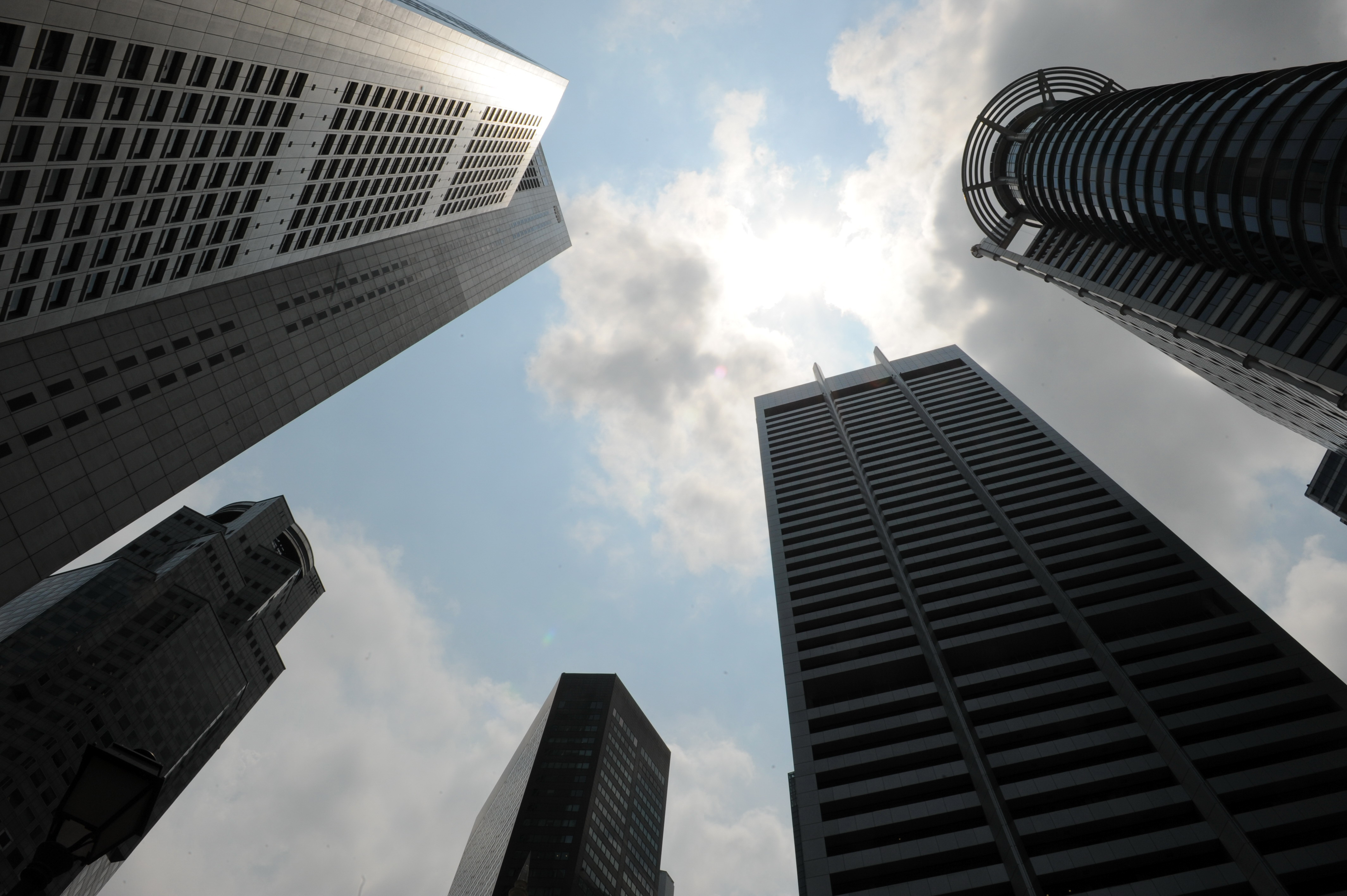 Clouds shade over the banking buildings