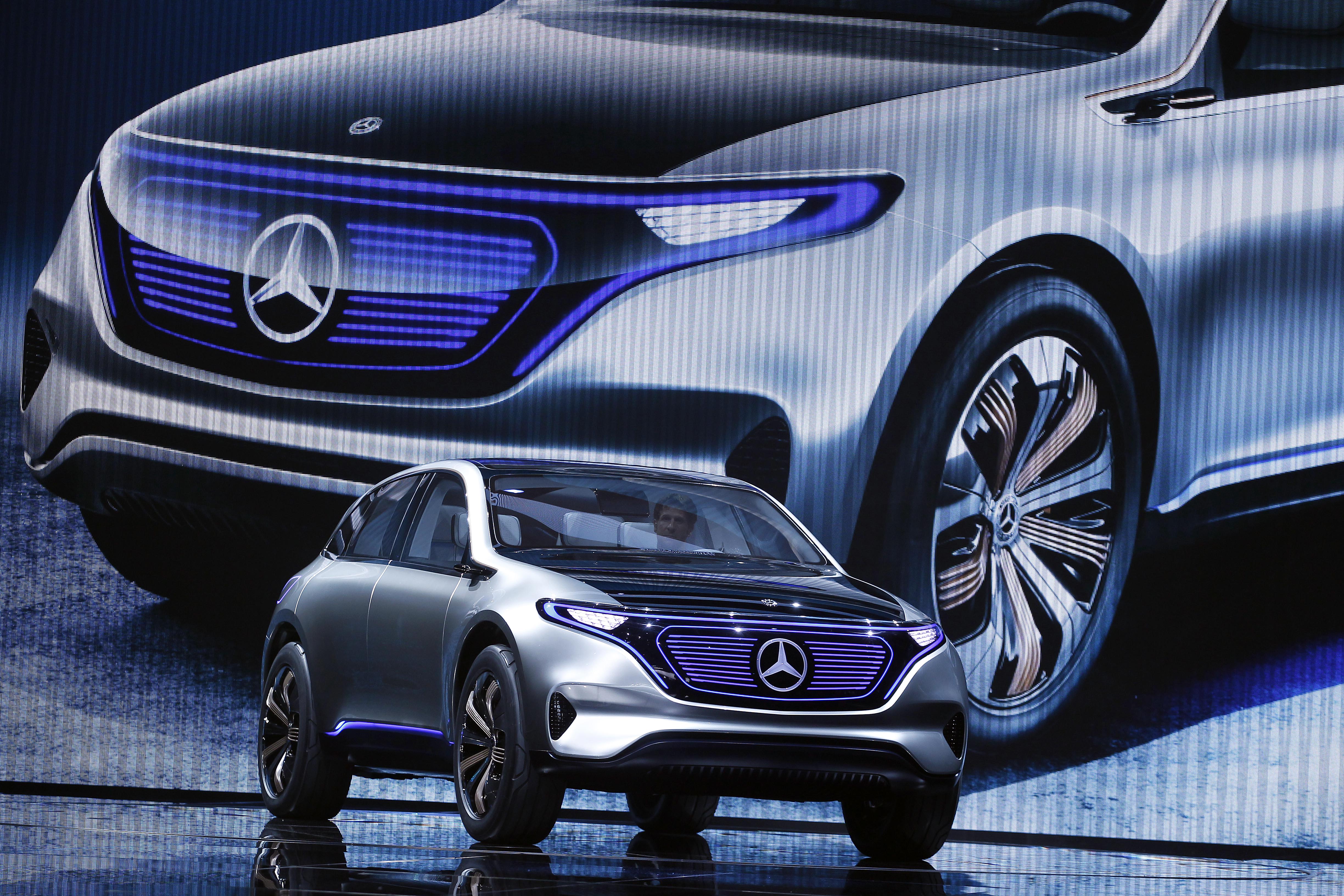 Dieter Zetsche, chief executive officer of Daimler AG, speaks on stage as he presents a new Mercedes-Benz Generation EQ concept sport-utility vehicle (SUV) during the 2016 press day of the Paris Motor Show.