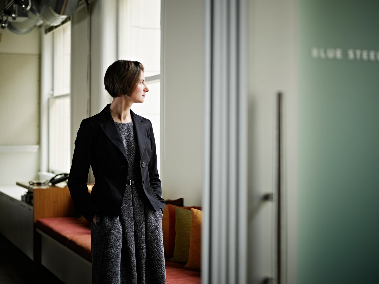 Businesswoman standing in office conference room