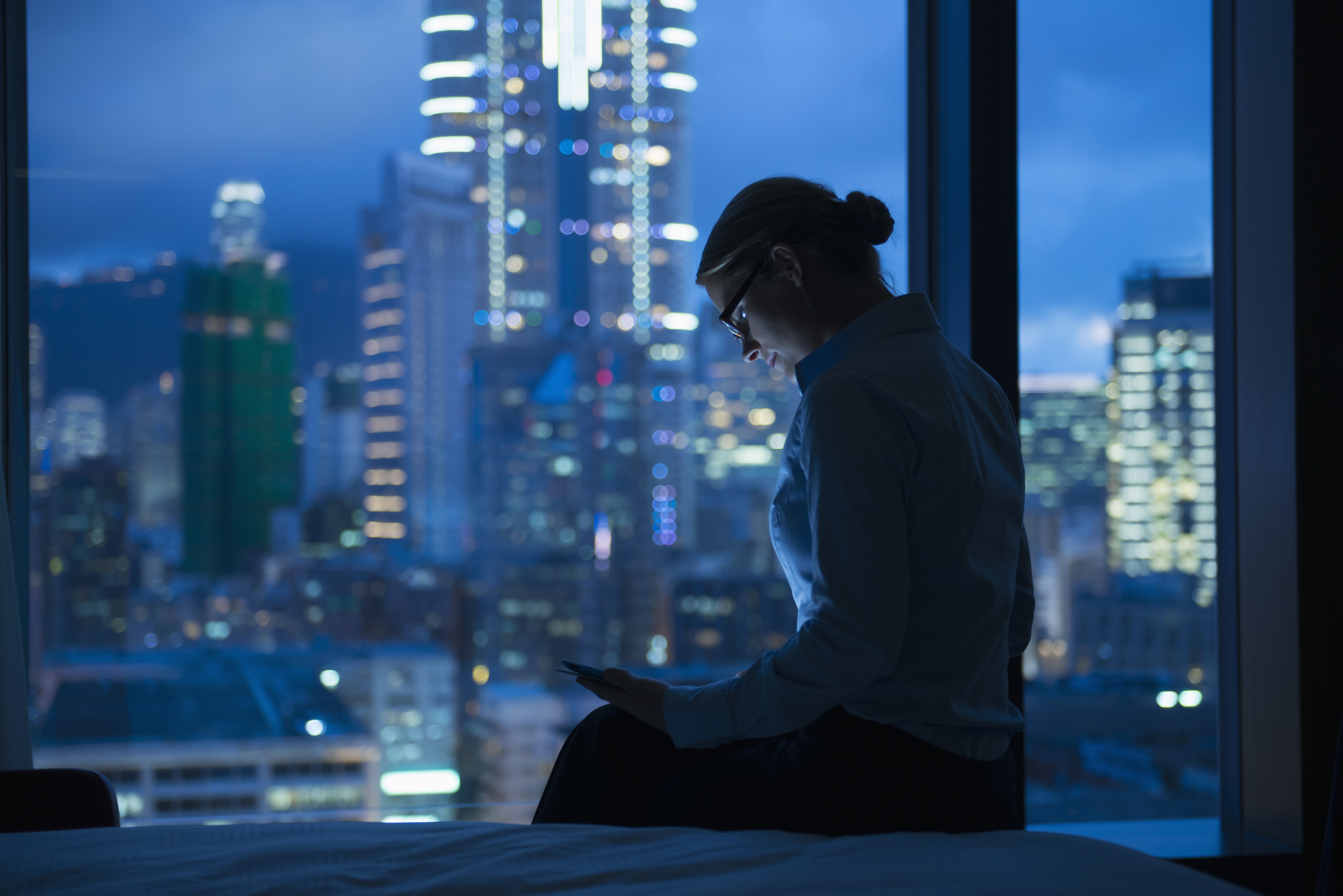 Caucasian businesswoman working late in office