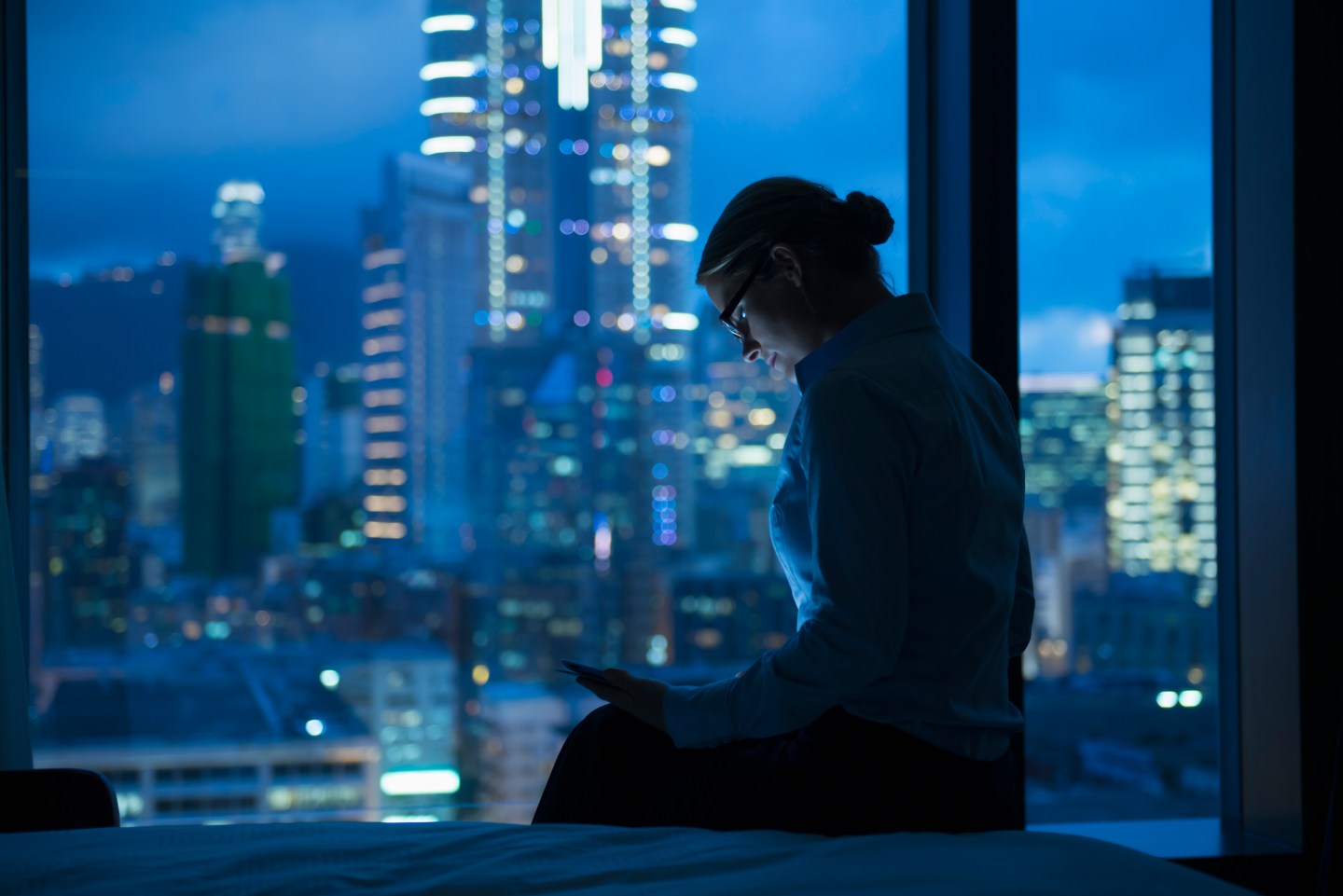 Caucasian businesswoman working late in office