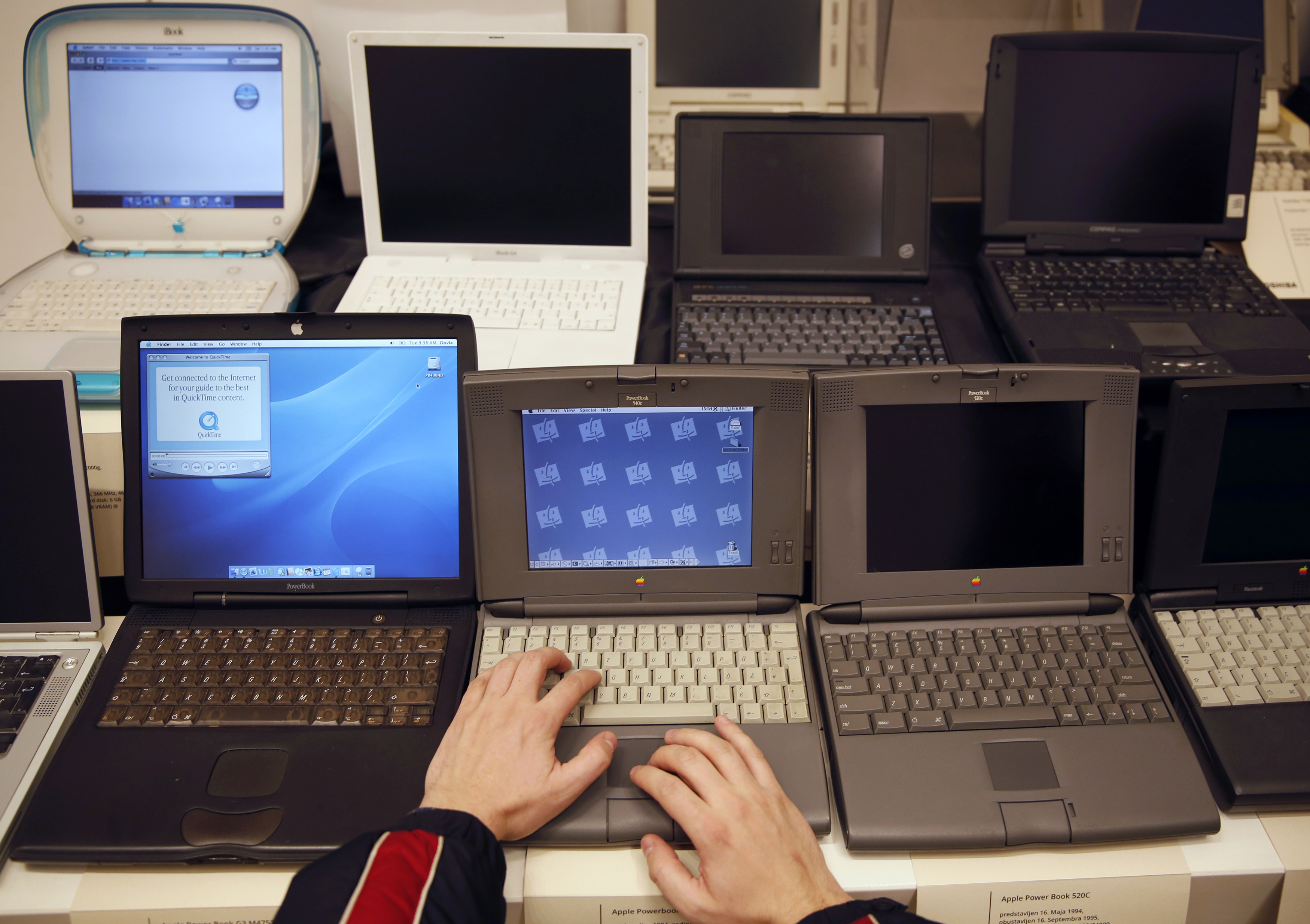 A man works on an Apple PowerBook 540c laptop during the "History of Computers" exhibition in Sarajevo