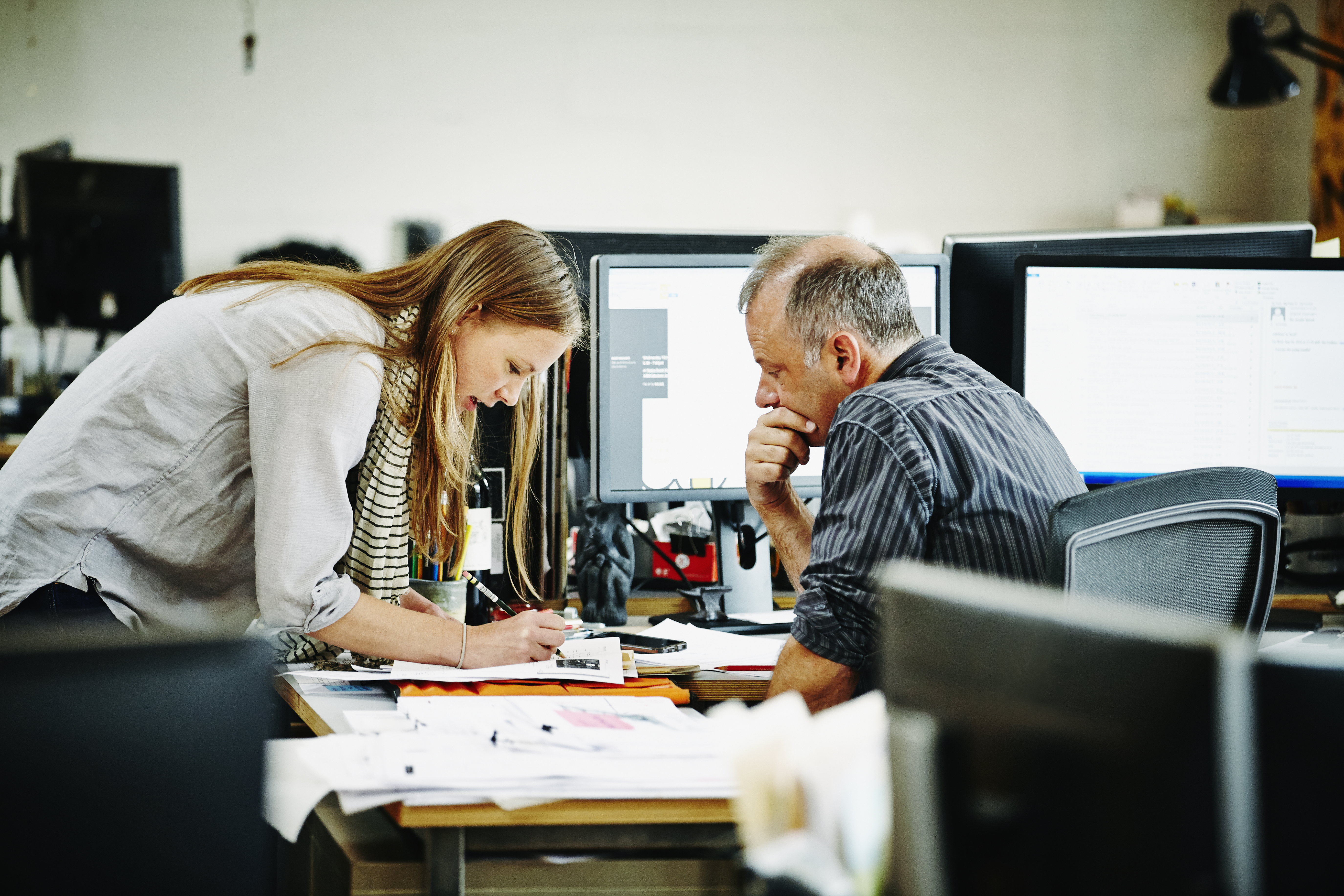 Architect discussing project with coworker