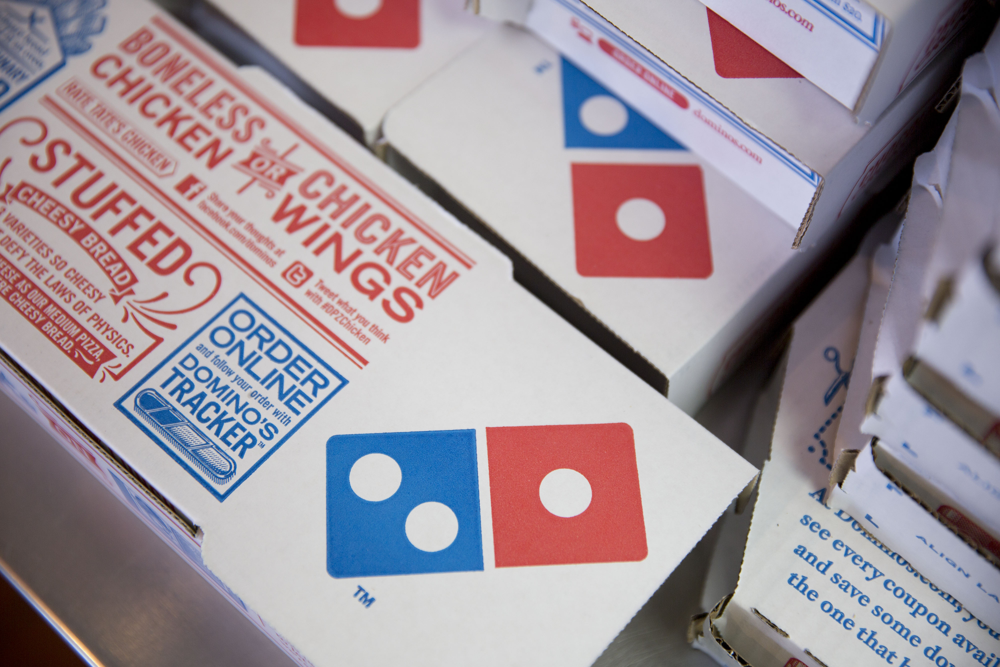 Boxes sit stacked at a Domino's Pizza Inc. restaurant.