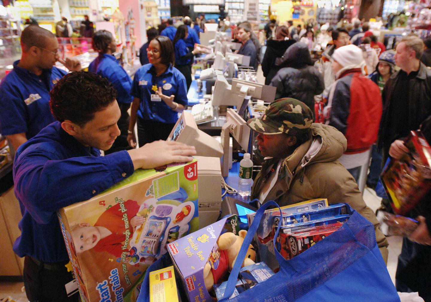 Mia Chaney (R) buys Christmas gifts for